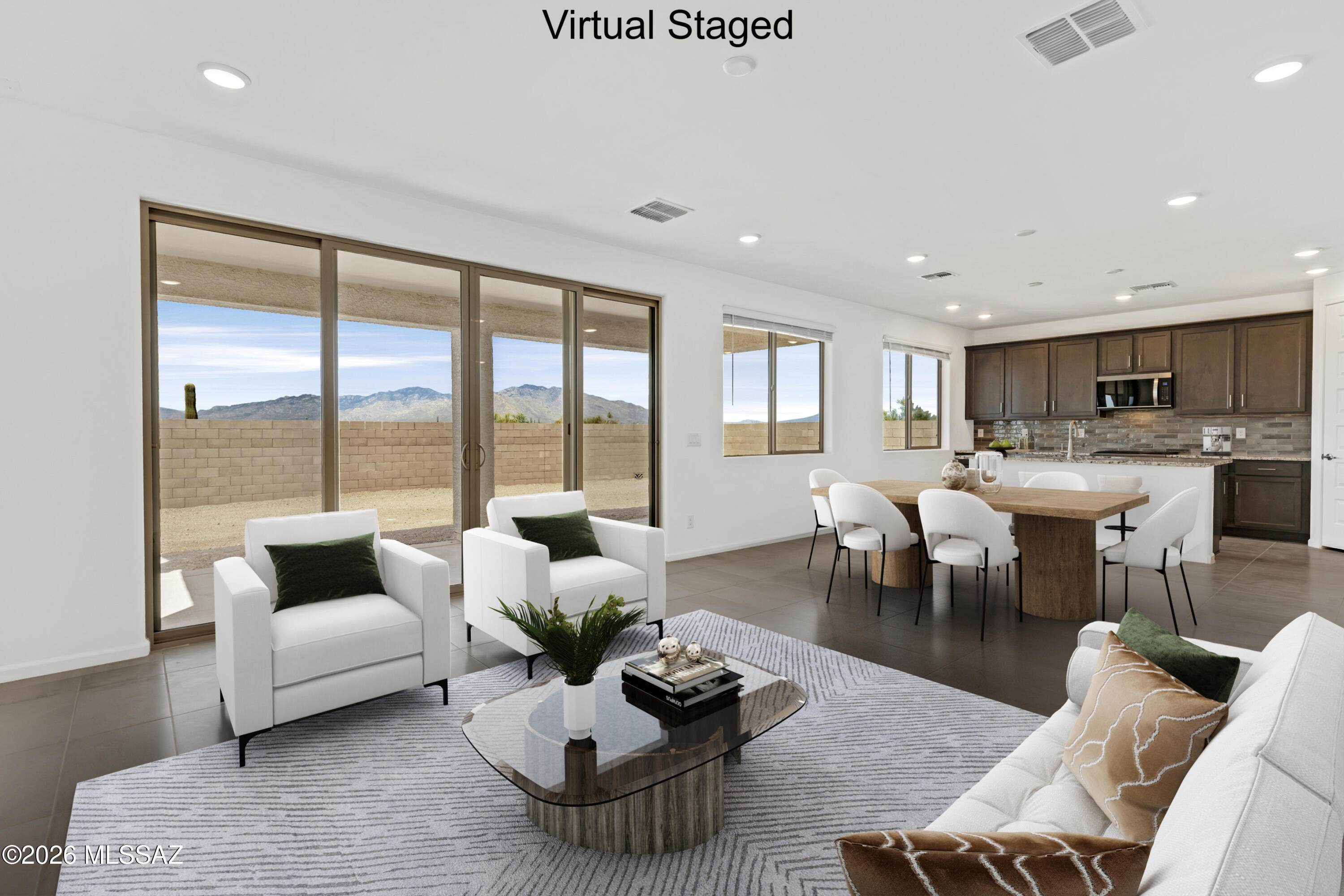 Sienna plan with a Desert Modern elevation. The welcoming covered front porch adds a touch of charm and leads into the first floor with open Greatroom, dining/kitchen area, Den and Study & Powder room. The kitchen is a culinary haven with a roomy center island, gas range, granite counters & walk-in pantry. Upstairs has Owner's Suite, versatile Loft area and 2 additional bedrooms & bath. The Owner's suite features an oversized walk-in closet, walk-in shower, linen closet & twin sinks. Includes refrigerator, washer/dryer & faux wood blinds. Est completion June '26.