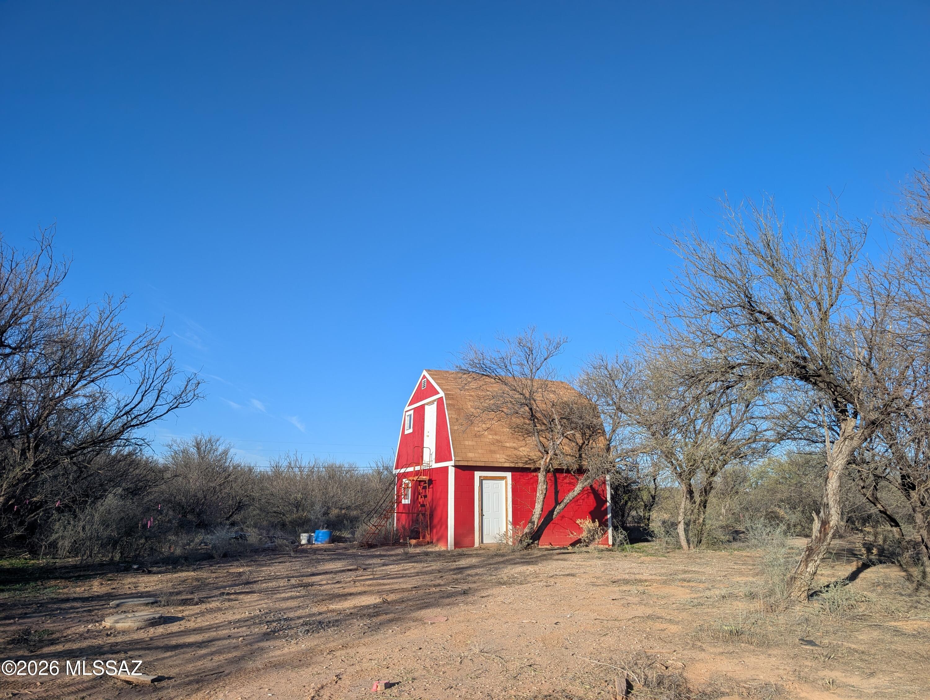 Just over 14 acres of wide‑open Arizona beauty in peaceful St. David, only minutes from shopping, dining and schools. This versatile parcel offers electric service, a 50% shared well, and onsite storage, making it an ideal foundation for your future home, ranch or getaway. Enjoy stunning views, quiet surroundings and easy access to town while still embracing the freedom of rural living.