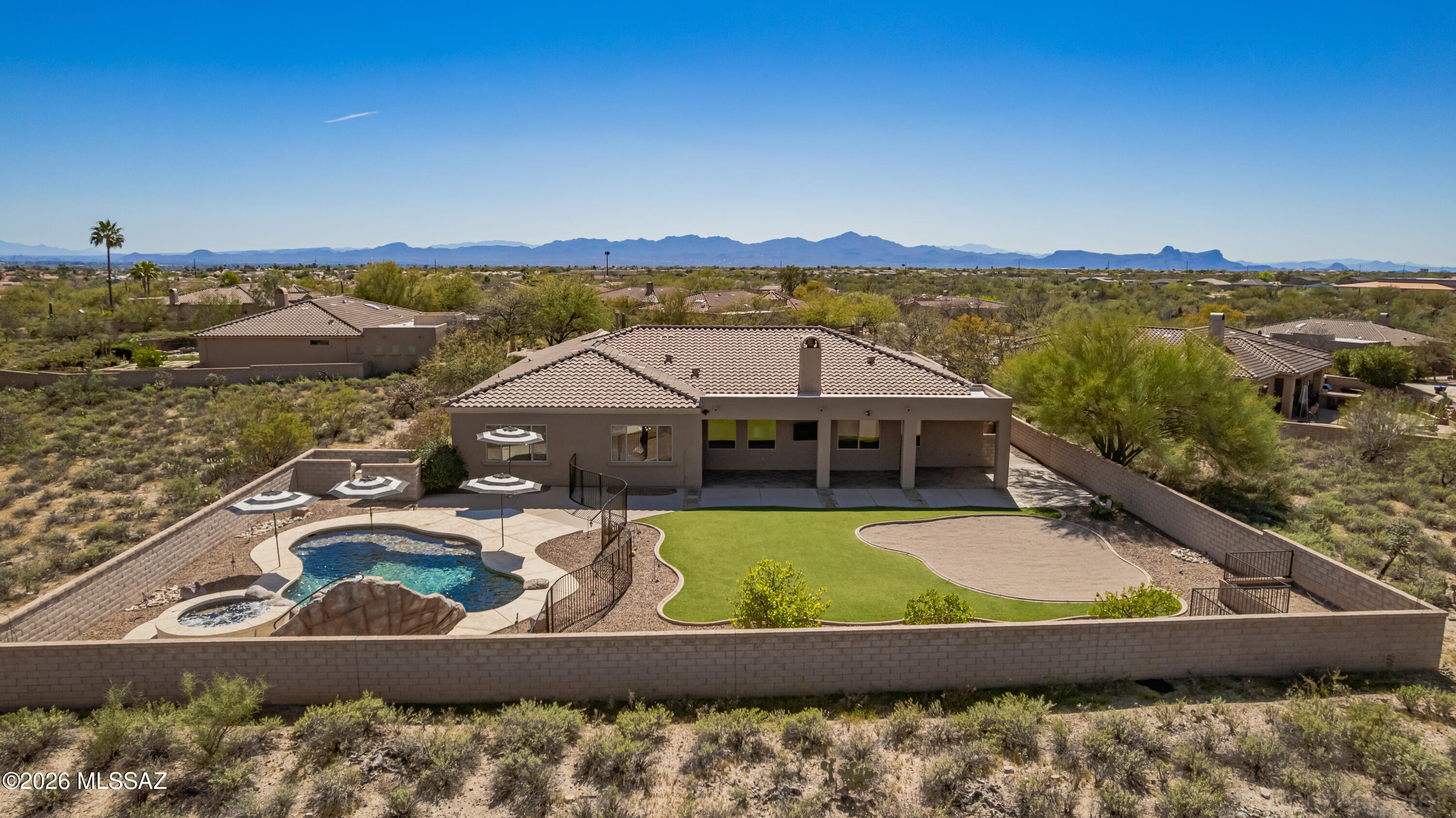 Welcome to an exquisite sanctuary nestled in the prestigious, gated community of Vistoso Gateway in Oro Valley, voted one of AZ's safest cities. This luxurious residence offers an unparalleled blend of privacy and opulence, situated on an expansive 0.85-acre lot at the end of a tranquil cul-de-sac. The captivating vistas of the majestic mountains serve as a breathtaking backdrop, creating a sense of tranquility and natural beauty to enjoy your resort-like pool and outdoor living space. Boasting 4 bedrooms, including a Jr. Primary, 3 baths, and 3 garages, this home caters to both comfort and sophistication. New roof in 2026. The unique feature of a junior primary suite provides flexible accommodation options, ideal for guests or multi-gen living. (continued) Revel in the serenity of your secluded haven, with the utmost privacy. Immerse yourself in the refined elegance and serene ambiance of this remarkable property, where luxury living meets the splendor of nature. Enjoy the lifestyle Oro Valley offers, with hiking, biking, shopping, parks, a rec center, schools, golfing, pickleball, fitness centers, Naranja park, and more nearby.