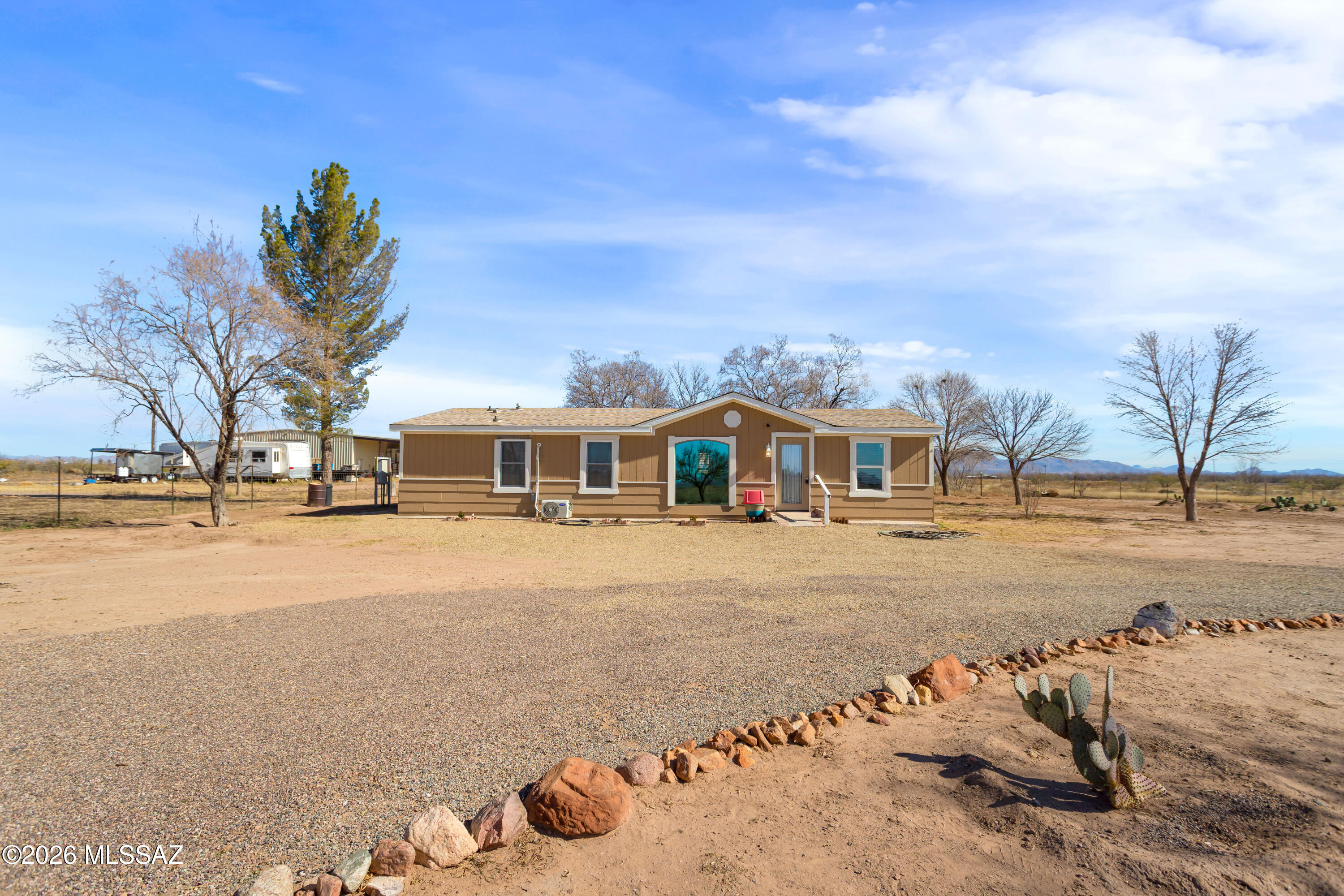 Move-in ready and thoughtfully updated, this remodeled manufactured home takes the worry out of future upgrades. Recent improvements include a new roof, many new windows, efficient mini-split systems, and new flooring throughout, creating a comfortable and low-maintenance living space. The kitchen includes a stainless steel refrigerator and stove, and the home is truly ready for immediate enjoyment.
Ideal for those looking for space, functionality, and modern updates—this property offers rural living with practical conveniences. Situated on 4 acres with RU-4 zoning, this property offers plenty of room for animals, gardening, or future expansion. Enjoy beautiful mountain views and a low-maintenance yard that's easy to care for. The property features city water, a private septic system, and is conveniently located on a county-maintained paved road, making access easy year-round. A full RV hookup adds excellent flexibility for guests, travel trailers, or additional parking options.
Seller will consider financing with $50,000 down, providing a great opportunity for buyers seeking flexible terms.