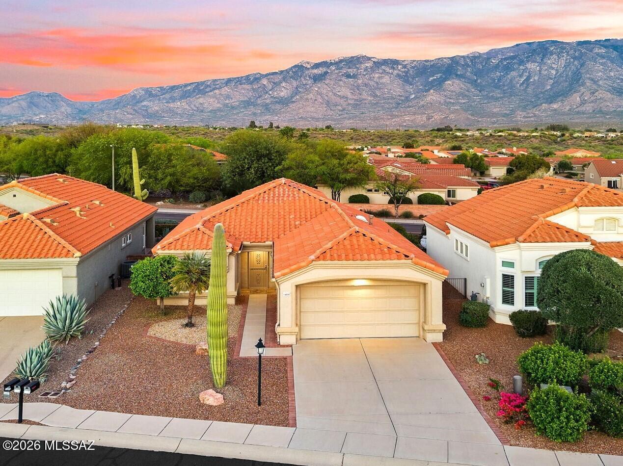 Bright & Beautiful Sun City Mariposa Model w/ Panoramic Catalina Mountain Views. This Top Quality 2BR / 2 BA 1,190 sq. ft. home boasts Magnificent Catalina Mountain Views from the Family Room, Kitchen, Owner's Suite & Back Patio! Enter into the XL Living Room w/ a Gorgeous New Stack Stone Fireplace. The Living Room is Open to the Updated Kitchen w/ Breakfast Bar & Dining Area w/ Views.  Owner's suite is large w/ an en-suite walk-in shower, dual sink vanity & walk-in closet w/ built-ins. Outdoors, relax & enjoy the Outstanding Views from the Covered Patio w/ new Paver Extension! New Roof 2022, New Windows & Slider 2025, New E-Blinds & Rolling Shutters 2025, HVAC 2016. Sun City Community Amenities: 18 Hole Golf Course, Pickleball, Pools, Tennis, Fitnes Ctr., Art Ctr., Clubs to Join & more!