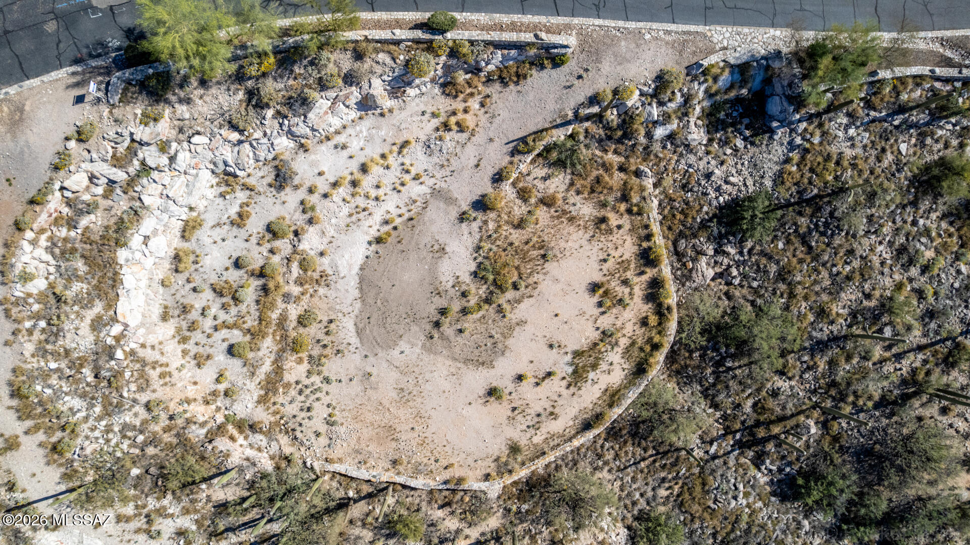UNBELIEVEABLE VIEWS!  This awesome lot is perched in the prestigious gated enclave of The Summit at Finger Rock.     Soak in sweeping panoramic vistas that shift beautifully from glowing sunrises over the mountains to incredible sparkling city lights and dramatic desert sunrises and sunsets.  This incredible lot offers a rare blend of privacy, elevation, and natural beauty.  Enjoy quick access to Finger Rock trails, and upscale dining and shopping just minutes away at La Encantada. All essential utilities, including sewer, water and power are at the lot.  Don't let this incredible READY TO BUILD value pass by! Make this yours today!
