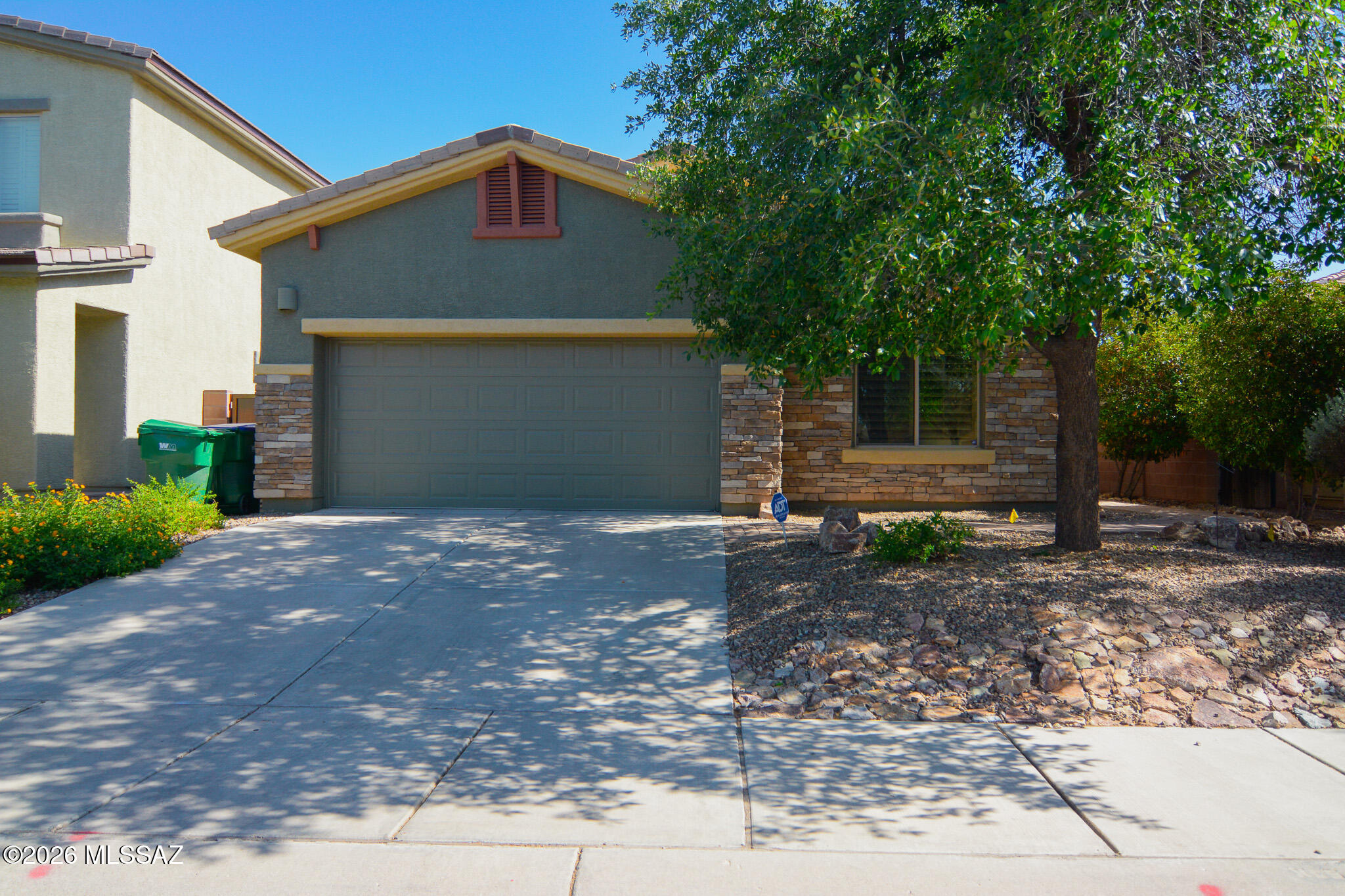 Beautifully maintained contemporary-style home. Located in a desirable Northwest Tucson location. Minutes from the I-10. Earth tone ceramic tile. Contemporary kitchen with stainless steel appliances. Spacious owner's suite with a walk-in closet. Contemporary bathrooms. New carpet and padding in bedrooms. Ceiling fans in each room. Fenced yard with mature trees, decorative gravel and fire pit. Two-car garage. New roof installed in 2023. Upgraded door hardware and light fixtures. This home shows beautifully.