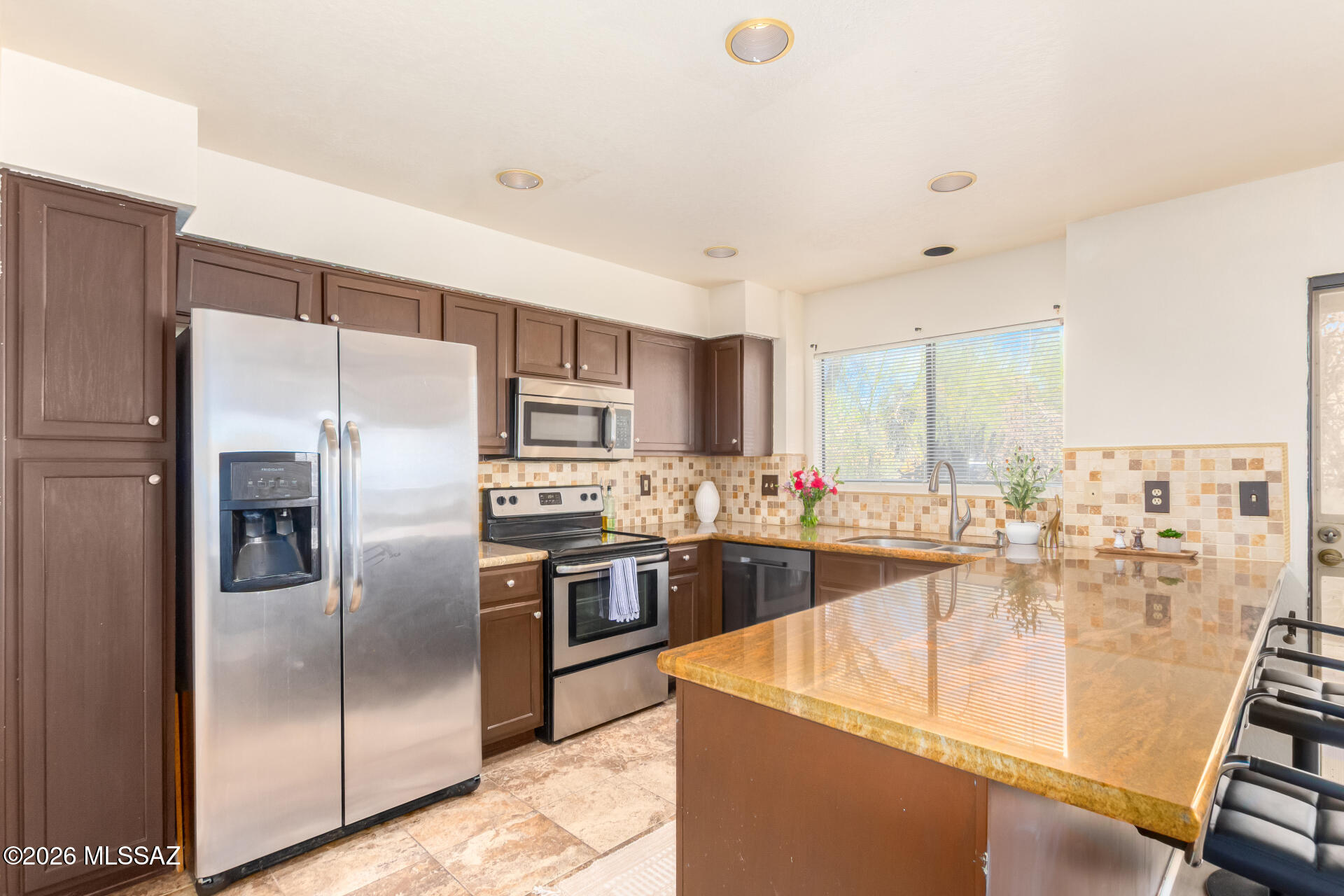 Available Mid-August | $2,500/Month | Solar Panels | Oro Valley

Backs to Open Desert - No Rear Neighbors!

Enjoy the privacy and beauty of the Sonoran Desert in this beautifully maintained home backing directly to the Canada del Oro Riverfront Park. With no rear neighbors, you'll wake up to peaceful desert views instead of another backyard-an uncommon feature for this rental rate in desirable Oro Valley.

Inside, natural light pours through the open floor plan featuring vaulted ceilings, a cozy fireplace, and spacious living areas designed for both everyday comfort and entertaining. The well-appointed kitchen includes granite countertops, rich wood cabinetry, stainless steel appliances, a mosaic tile backsplash, recessed lighting, and a breakfast bar with peninsula seating. Just off the kitchen is a versatile bonus space with sliding glass doors leading to the backyard-perfect as a breakfast nook, family room, home office, or play area.

The spacious primary suite features vaulted ceilings, tranquil desert views, mirrored closet doors, an additional walk-in closet, and a private ensuite bath with dual sinks.

Step outside to enjoy a low-maintenance backyard with a paver patio, natural desert landscaping, and uninterrupted open space behind the home offering exceptional privacy and room to relax.

Home Features:
" 3 Bedrooms / 3 Bathrooms
" Open floor plan with vaulted ceilings
" Cozy fireplace
" Granite countertops & stainless steel appliances
" Flexible bonus living space
" Spacious primary suite with dual closets
" Solar panels for reduced electric costs
" Private backyard backing to open desert
" No rear neighbors

Located in the sought-after Lambert Lane neighborhood, you'll enjoy quick access to Canada del Oro Riverfront Park, The Loop's miles of walking and biking trails, shopping, restaurants, and everything Oro Valley's northwest lifestyle has to offer.

Rent: $2,500 per month
Available: Mid-August
Tenant responsible for utilities
Please do not disturb the current occupants.

Contact us today for additional information or to schedule a showing.