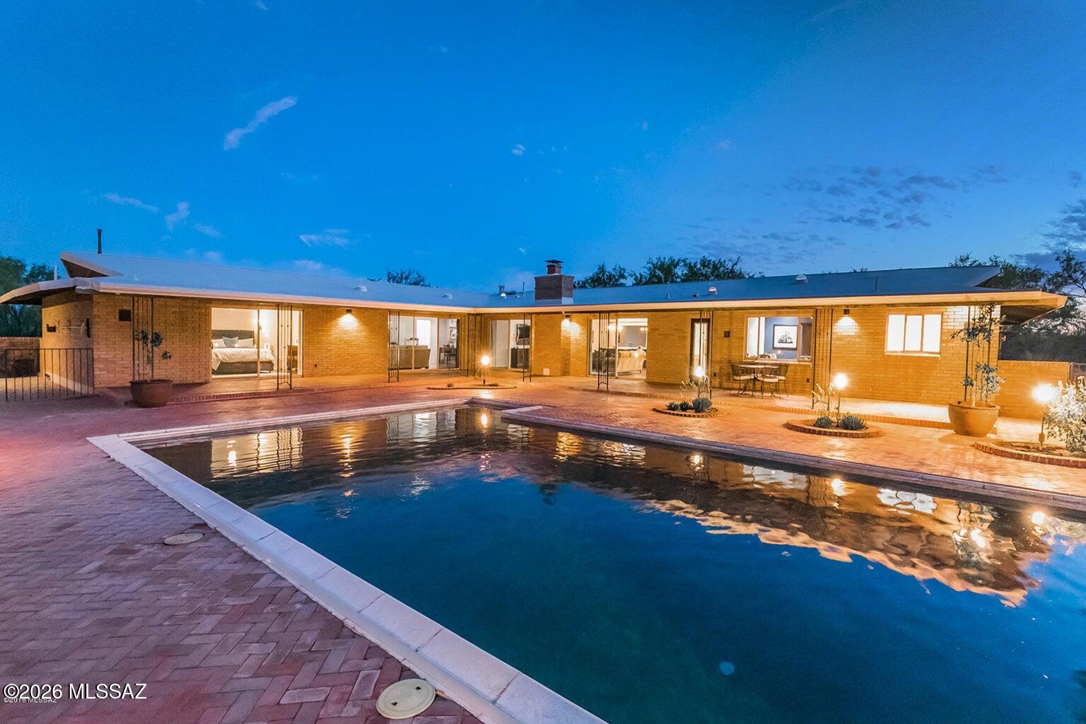 Nestled near the breathtaking beauty of Sabino Canyon, this exceptional luxury home offers the perfect blend of elegance, comfort, and Arizona living. Designed with an open-concept floor plan, the home is filled with natural light from expansive windows that frame spectacular mountain views.The gourmet kitchen is a chef's dream, featuring an abundant workspace, and seamless flow into the spacious living and dining areas ideal for both everyday living and entertaining. A versatile bonus room provides endless possibilities for a home office, fitness space, or game room.Retreat to the luxurious primary suite, while the generously sized guest bedrooms provide welcoming accommodations for family and visitors. Step outside to your own sparkling pool, built-in BBQ, covered patios & views.