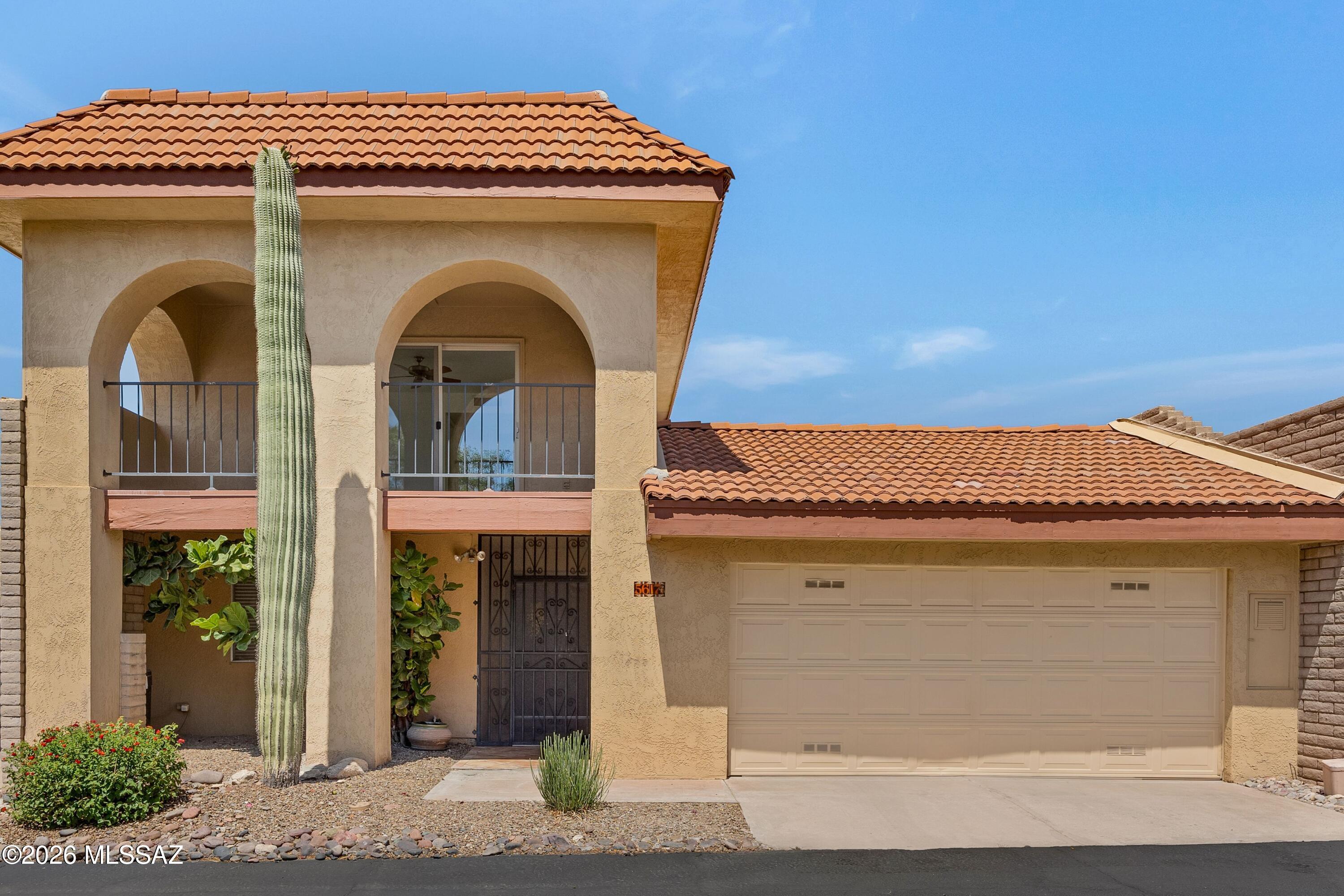 Beautiful home featuring an exceptional floor plan with two primary suites and a spacious third bedroom ideally situated in the Catalina Foothills on a premier exterior lot. Move-in ready with fresh interior paint, new carpet upstairs, and solid flooring throughout the main level. The expansive living area is filled with natural light and overlooks a private oversized backyard with a covered patio and citrus trees(no rear neighbors). The upstairs primary suite features a private balcony with views over Tucson and the mountains. Residents enjoy an impressive array of HOA amenities including cable, internet, trash service, front landscaping, two pools (one heated), spa, clubhouse, fitness center, playground, and lighted tennis, pickleball, basketball courts. District 16 school