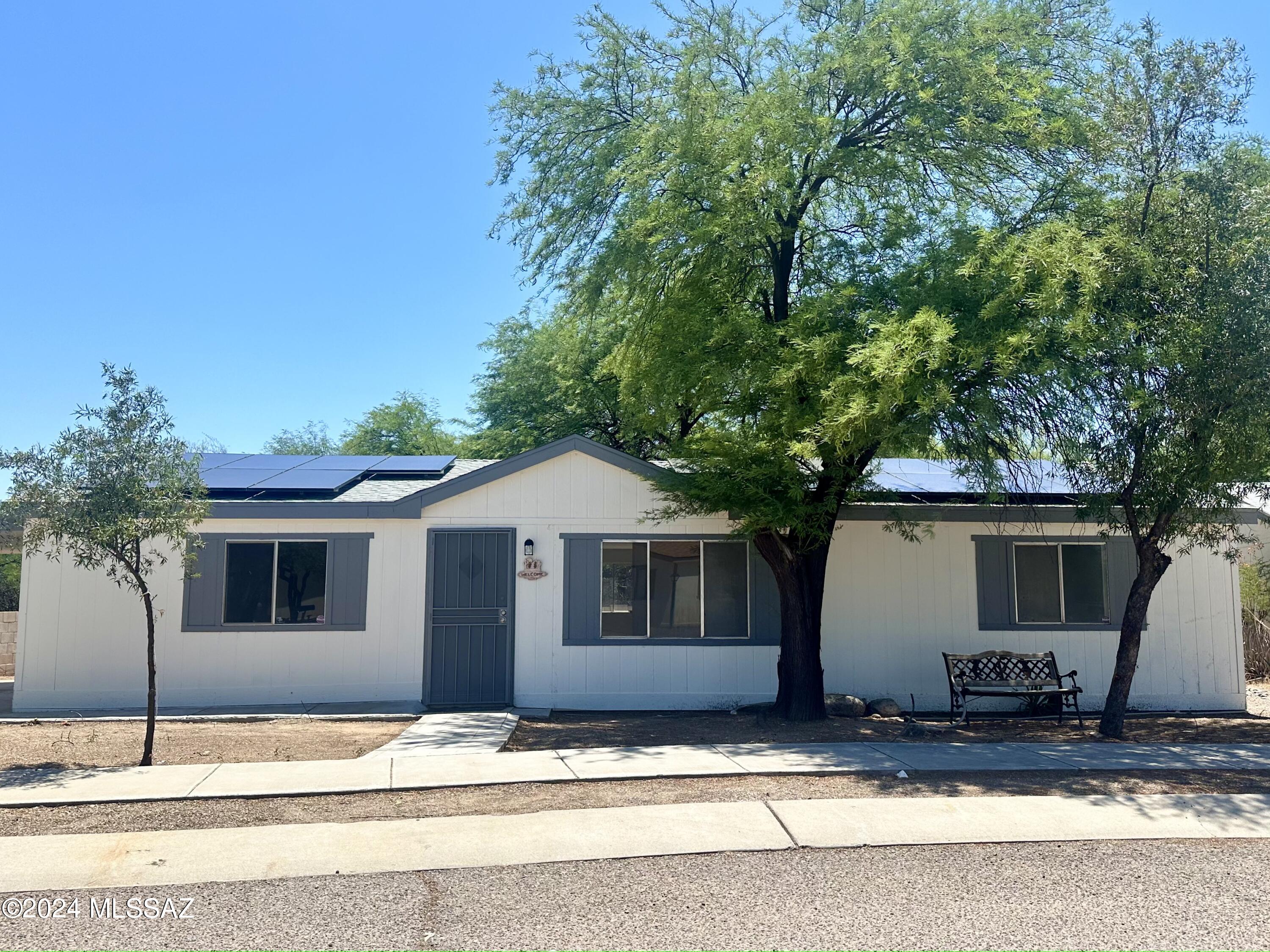 Buyer cancel after seller did all repairs, price adjusted with recent appraisal, READY FOR MOVE IN!
Beautiful remodeled manufacture home, with a spacious living room, 3 bedrooms, 2 bathrooms & a laundry room. A fenced backyard with a porch & trees backing up to a wash. Home is located less than 10 minutes away from Davis Monthan, schools, shopping, freeway & more! Give this home a touch of love & it can become your forever home! Hurry this one won't last! OWNER SOLAR SYSTEM!