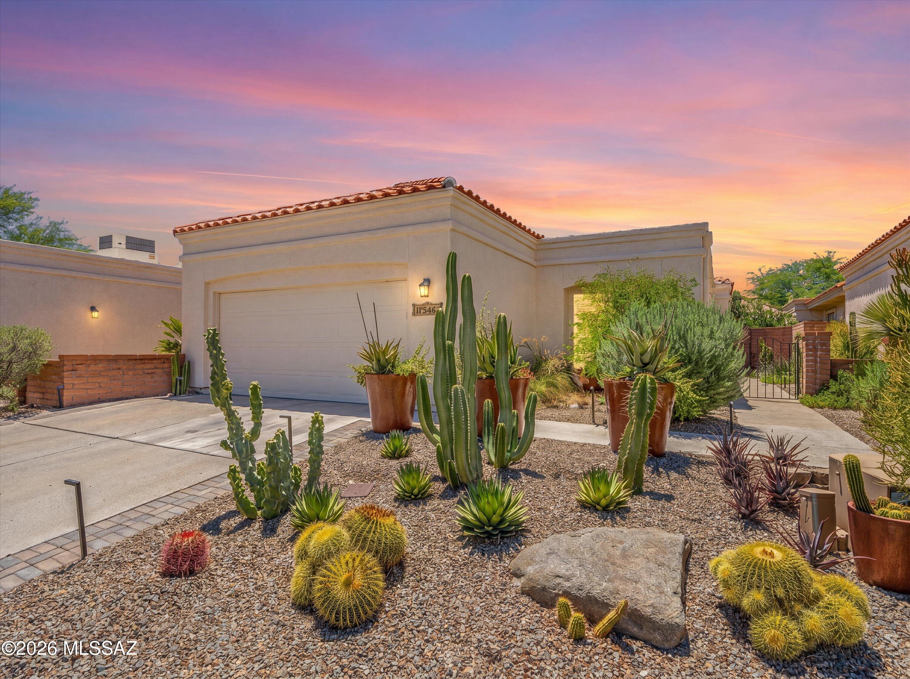 Presenting a truly exceptional, one-of-a-kind Fairfield residence, meticulously reimagined through a comprehensive, floor-to-ceiling renovation. This impeccably redesigned home offers 2 bedrooms, 2 bathrooms, plus a versatile office or fitness studio, blending sophisticated luxury with effortless desert living.

Thoughtfully curated by professional designers, the home's transformation includes the removal of walls to create an  open-concept floor plan ideal for both everyday living and elegant entertaining. The stunning chef's kitchen serves as the heart of the home, featuring an oversized center island, premium Wolf appliances, double ovens, an induction cooktop, and a striking two-way gas fireplace that creates a warm, inviting ambiance shared between the living and dining spaces. Adjacent to the living area, a custom Wolf coffee and beverage station elevates daily living, complete with a built-in coffee system and wine/beverage refrigerator.

Equally impressive are the professionally designed grounds, where beauty and sustainability were prioritized at every turn. Mature, low-maintenance landscaping surrounds the property, creating a private desert sanctuary that seamlessly complements the natural surroundings.

Enjoy Arizona's indoor-outdoor lifestyle from three distinct outdoor living spaces: a screened-in patio, a rear porch to soak in sunsets, mountain views and pristine desert landscapes, and an intimate side courtyard featuring an outdoor BBQ, dining area, and lounge space perfect for entertaining under the stars.

Residents enjoy access to Fairfield's desirable amenities, including a community pool, spa, ramada, and walking paths. Ideally located just minutes from fine dining, shopping, grocery stores, award-winning resorts, premier golf course, Sabino Canyon Recreation Area, and some of the area's most sought-after schools.

An extraordinary opportunity to own a fully customized luxury retreat in one of Tucson's most desirable communities.