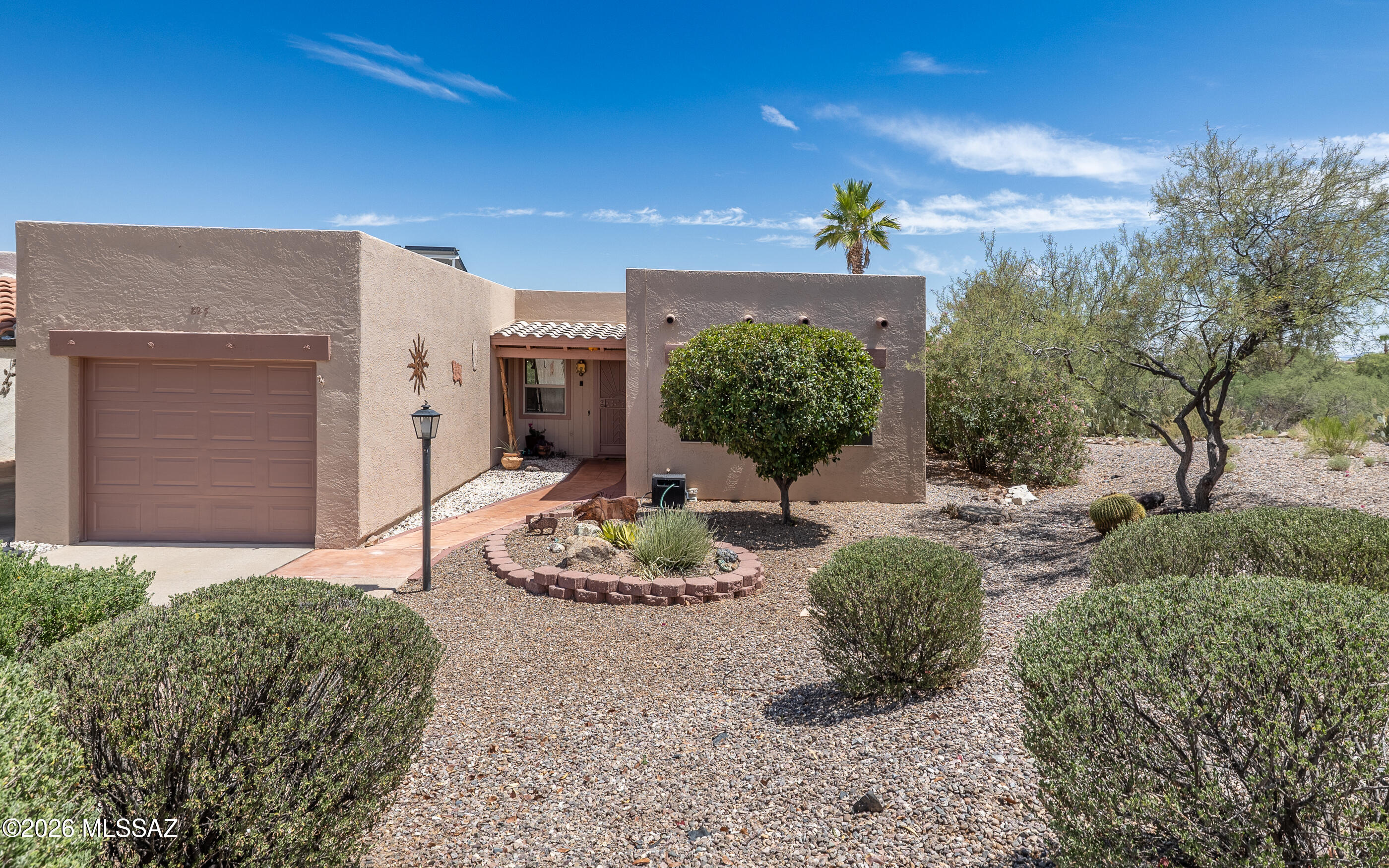 Looking for fabulous Mountain and Arroyo Views while you relax and enjoy life? You can have that when you decide on this treasure in Continental Vistas. This well care for townhouse is a beauty - 2 bedrooms, 2 bathrooms, a sunroom and a one-car garage and a laundry area just off the kitchen with an owned solar instant hot water heater. At least two things really stand out with this house: the lovely sunroom which allows you to take in the magnificant Santa Rita Mountains along with the common area arroyo and desert just below. With the enhanced floor plan, you can enjoy these views from both the living room and kitchen. Another plus: this house is located on a quiet street, just a few blocks from a GVR community pool, spa and clubhouse.