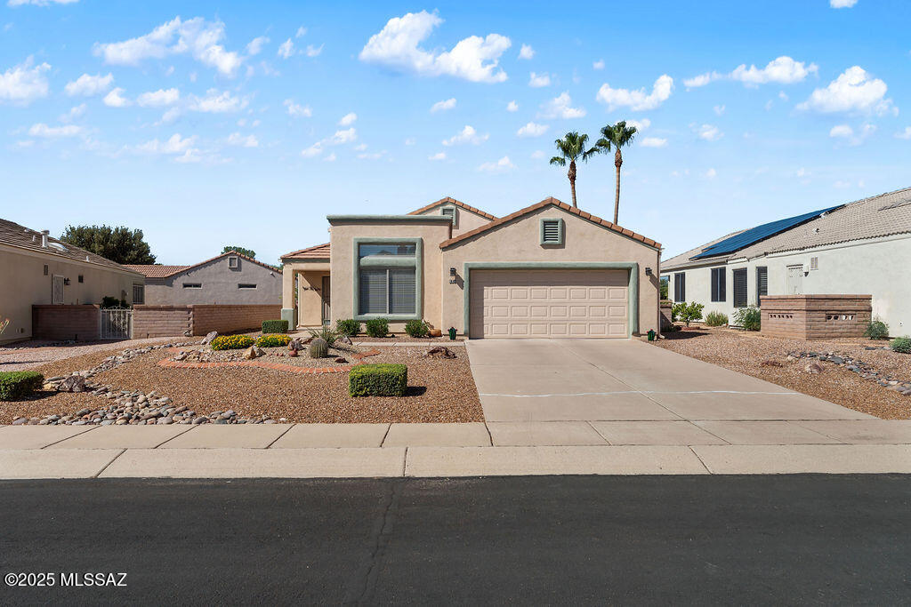 Welcome to this beautiful home in the gated community of The Greens! This well-cared-for property features an open floor plan with vaulted ceilings, recessed lighting, and multiple skylights that fill the home with natural light. With tile and wood flooring throughout—no carpet—this home is both stylish and easy to maintain.

The updated kitchen is a true highlight, offering refreshed cabinets, new granite countertops, a new undermounted sink, cabinet pullouts, and two pantry closets—blending modern appeal with everyday functionality. A versatile hobby room provides the perfect space for crafts, a home office, or extra storage.

Recent upgrades include a 2024 water heater and a 2019 HVAC system, ensuring comfort and energy efficiency. Outdoor living is equally impressive, with two covered patios, a beautiful pergola, mountain views to the south, and three sliding glass doors leading to a serene backyard with brick pavers, low-maintenance landscaping, and enclosed with a beautiful slump block wall.

This home offers comfort, quality, and convenienceall in a desirable gated setting. Come see it today!