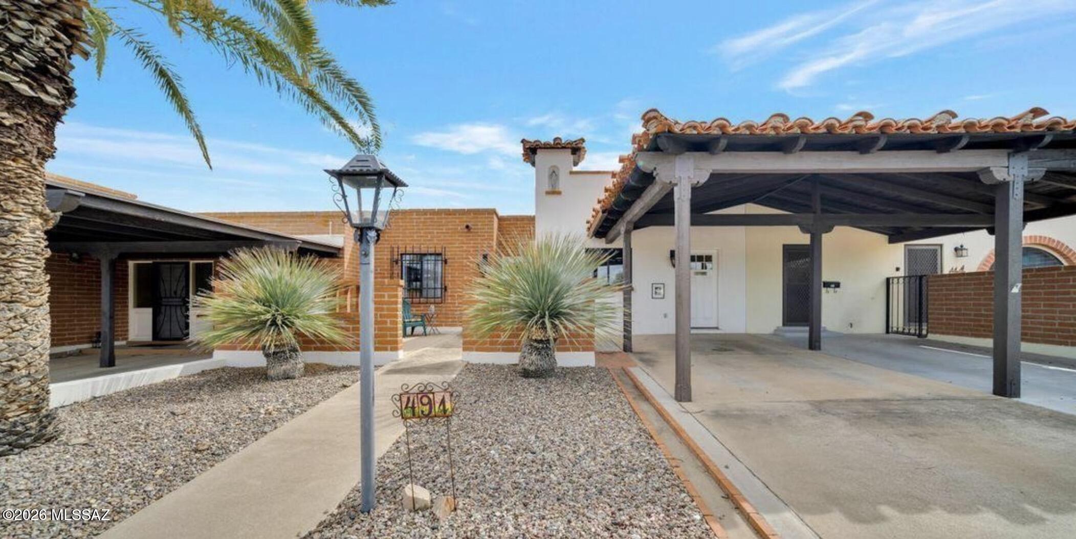 Charming townhouse located  in the heart of Green Valley featuring a large kitchen with tile countertops and an abundance of cabinets, kitchen opens up into a spacious dining/living room with beautiful tile flooring, a nice sized master bedroom with upgraded master bath and space  for a desk, designer paint colors throughout, extended laundry and utility room off the kitchen. The cozy front courtyard looks out into a park like setting rich in Arizona landscaping and wildlife. Beautiful 3 pane sliders invite you to relax on the very private and peaceful back patio, partially covered for your comfort. Enjoy your retirement in this very quaint home.