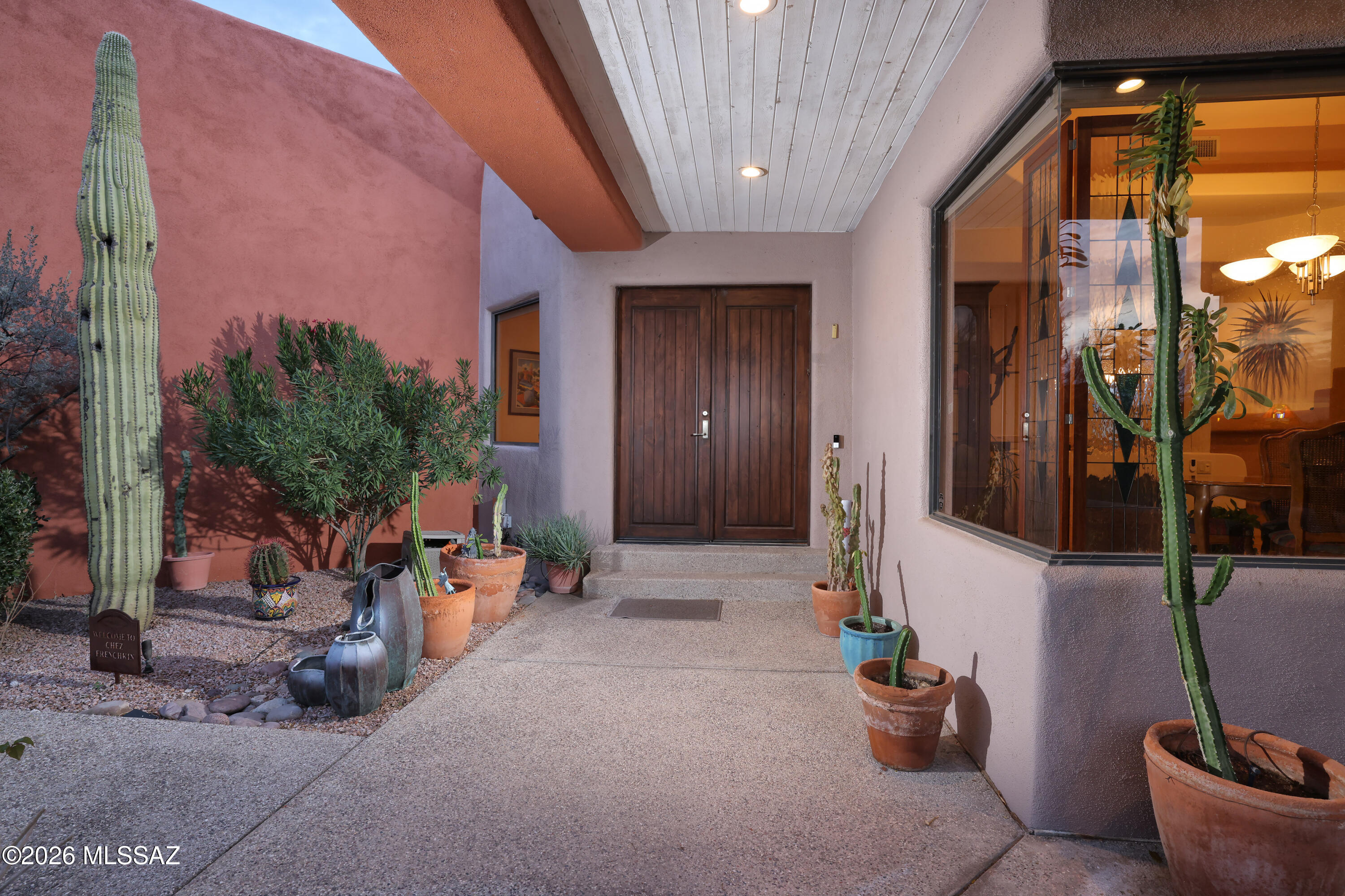 Captivating city lights, mountain views, and the beauty of the surrounding desert landscape provide a stunning backdrop for this meticulously maintained foothills home on 1.24 private acres. Designed to live like a single-story home with flexible guest quarters below, the elevated main level captures the views beautifully while offering the convenience of the primary suite, kitchen, living areas, and three additional bedrooms all on one floor.
Quality finishes throughout include Brazilian cherry flooring, Saltillo tile, travertine, and engineered wood flooring with no carpet. Expansive windows and two private balconies--one off the kitchen and one off the primary suite--invite you to enjoy Tucson's spectacular sunsets, sparkling evening lights, and ever-changing desert scenery. The walk-out lower level provides exceptional flexibility with a separate entrance, private bedroom, living area, bath, wet bar, refrigerator, and abundant storage. Ideal for guests, multigenerational living, a home office, studio, or private retreat, this space offers versatility rarely found in today's market. No HOA.
A three-car garage includes a heated and cooled bay ideal for a workshop, fitness room, hobby space, or additional storage. Combining privacy, quality finishes, an exceptional floor plan, and unforgettable views, this thoughtfully designed home offers a unique foothills lifestyle.  See MLS for a complete list of features, improvements, and upgrades.