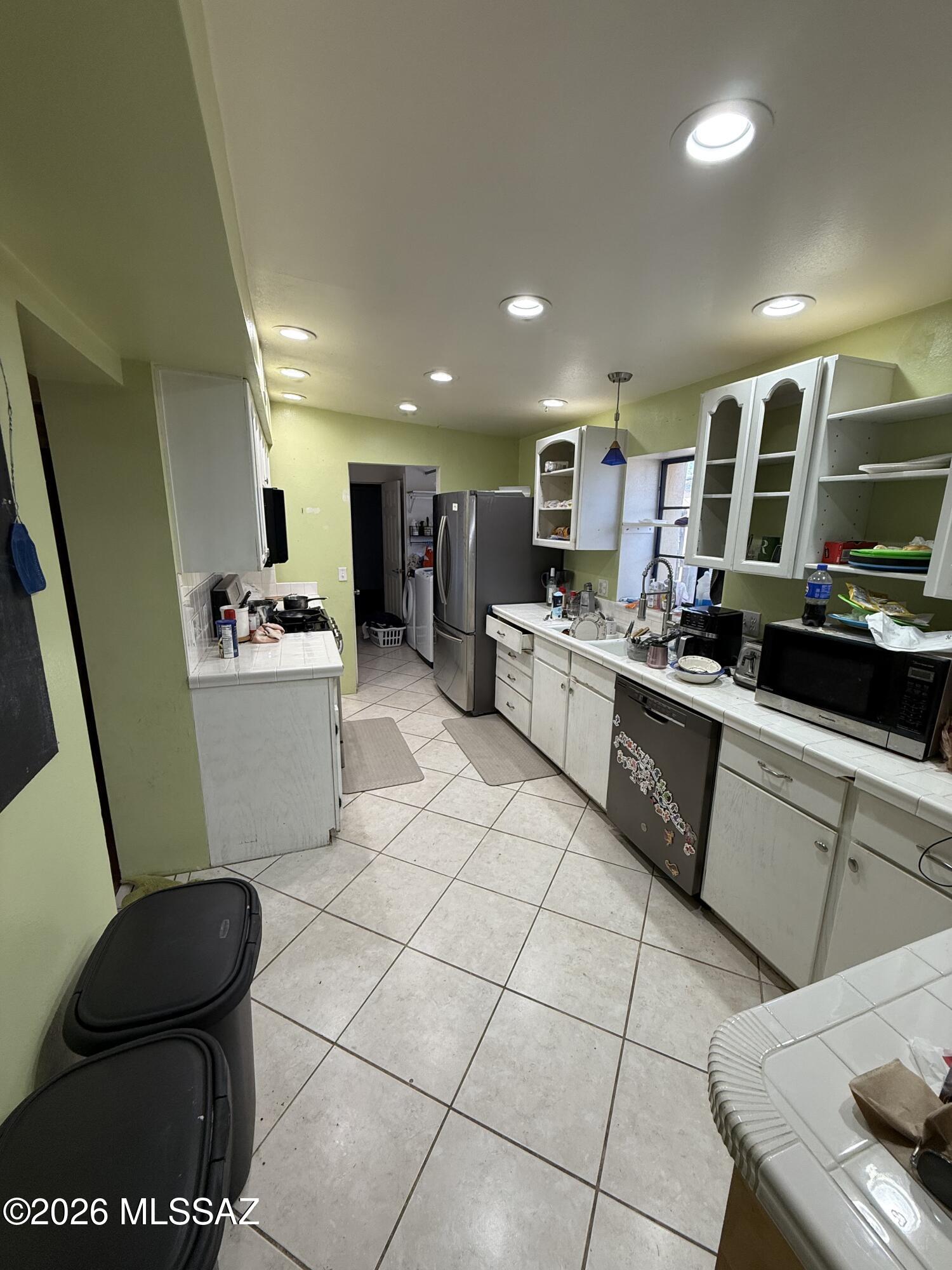 Spacious 3-bedroom, 2-bath home offering approximately 1,700 square feet on a fully fenced 0.20-acre lot in a convenient central Tucson location, just minutes from the University of Arizona. With only a little TLC, this property presents an excellent opportunity to build equity while enjoying features like established garden beds, a chicken coop for urban homesteading, and a large backyard. Conveniently located near shopping, dining, schools, and major transportation routes, this home offers space, potential, and a prime location.