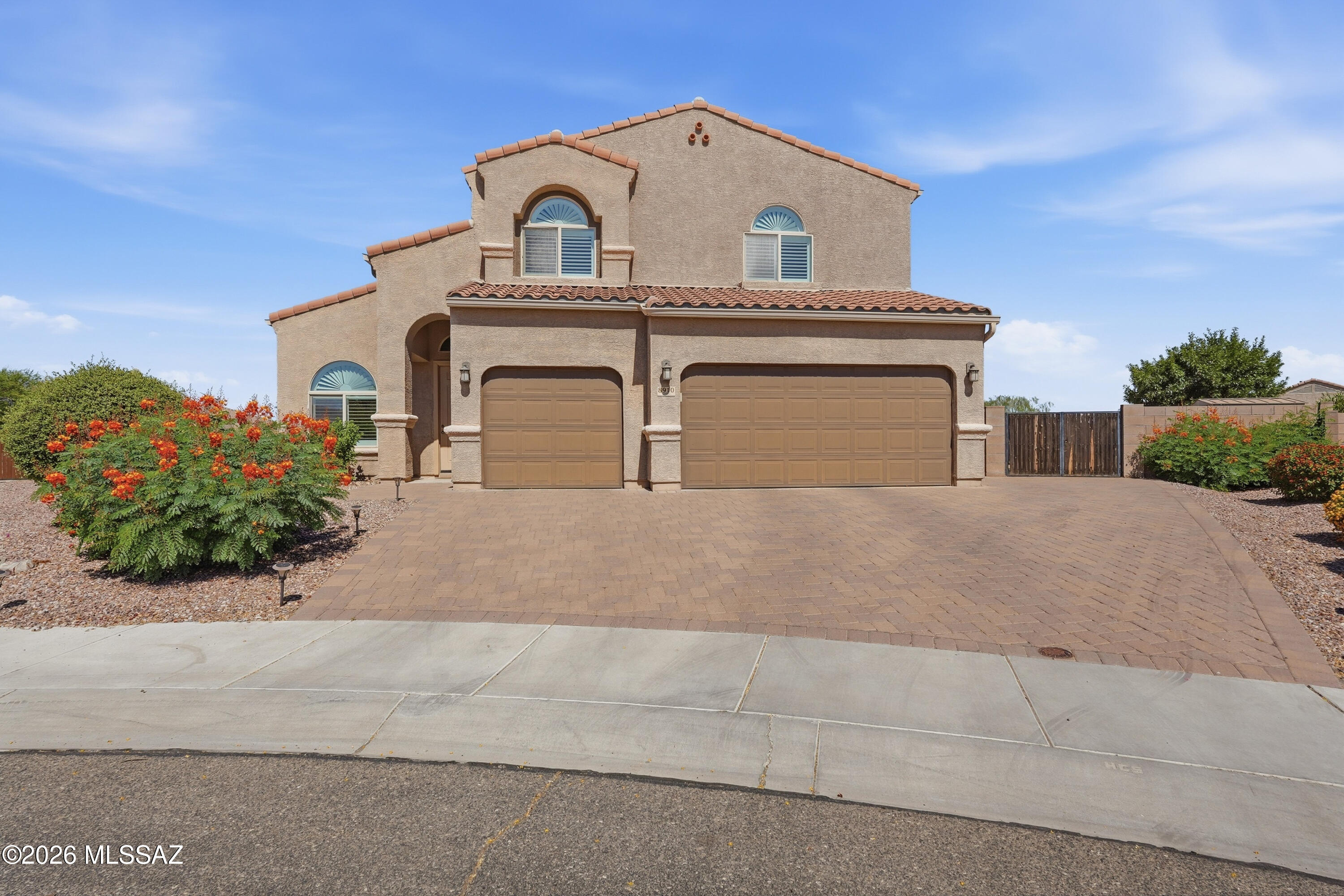 No Application Fees! Spacious 4-bedroom, 3-bathroom Marana home located in the desirable Saguaro Springs community. This beautifully maintained home offers over 3,100 square feet of exceptional living space with a front living room, formal dining area, spacious family room, and oversized upstairs loft that is perfect for a media room, game room, home office, or additional family room. Interior upgrades include wood plank style tile flooring throughout all living and high traffic areas with upgraded carpeting in the bedrooms and upstairs, vaulted ceilings, two-tone neutral paint, plantation shutters, ceiling fans throughout, upgraded fixtures, and abundant natural lighting. The beautifully appointed kitchen features granite countertops, tile backsplash, upgraded cabinetry with crown molding, oversized island with breakfast bar, separate pantry, built-in double ovens, gas cooktop, stainless steel appliances, and ample cabinet and counter space. One bedroom and a full bathroom are conveniently located on the first floor, making it ideal for guests or multigenerational living. The remaining bedrooms are located upstairs, including the oversized primary suite featuring a large walk-in closet, dual sink vanity, separate linen closet, and spacious step-in shower. A full-size washing machine and dryer are included for added convenience, and the attached three-car garage provides exceptional parking and storage space.

The backyard is truly designed for entertaining and is situated on a spacious cul-de-sac lot with only one adjoining neighbor for added privacy. Enjoy an extended covered patio with beautiful travertine decking, sparkling pool with Baja shelf, adjoining spa, outdoor kitchen with built-in barbecue, wet bar and breakfast bar, additional seating area, synthetic grass, and professionally landscaped grounds that create an outstanding outdoor living experience.

Saguaro Springs offers neighborhood parks, walking paths, playgrounds, and beautiful mountain views throughout the community. Conveniently located near shopping, restaurants, golf courses, schools, and outdoor recreation with easy access to I-10, Downtown Tucson, Dove Mountain, and the growing Marana employment corridor.

All Denali Real Estate residents are automatically enrolled in the Resident Benefits Package (RBP) for $55.00/month which includes Renter's Liability Insurance, Credit Building to help boost the resident's credit scores with timely rent payments, up to $1M Identity Theft Protection, HVAC air filter delivery (for applicable properties), our best-in-class resident rewards program, and much more!