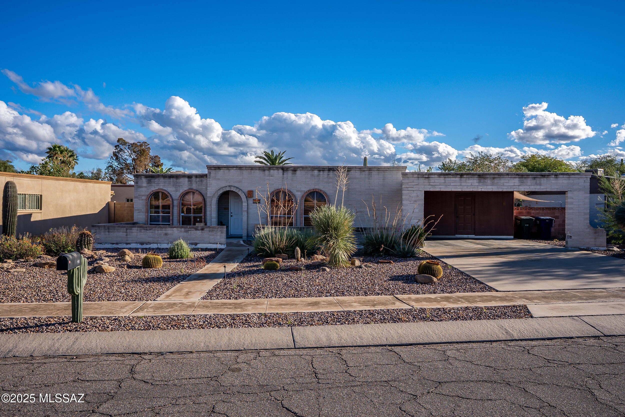 Discover this inviting 3-bedroom, 2-bath brick home nestled in a friendly eastside Tucson neighborhood. The living room features a charming fireplace and elegant wooden window shutters that add warmth and character to the space. Enjoy the sparkling pool and take in the beautiful mountain views Tucson has to offer. Conveniently located near shopping, dining, and entertainment, this home offers the perfect mix of comfort, style, and accessibility.