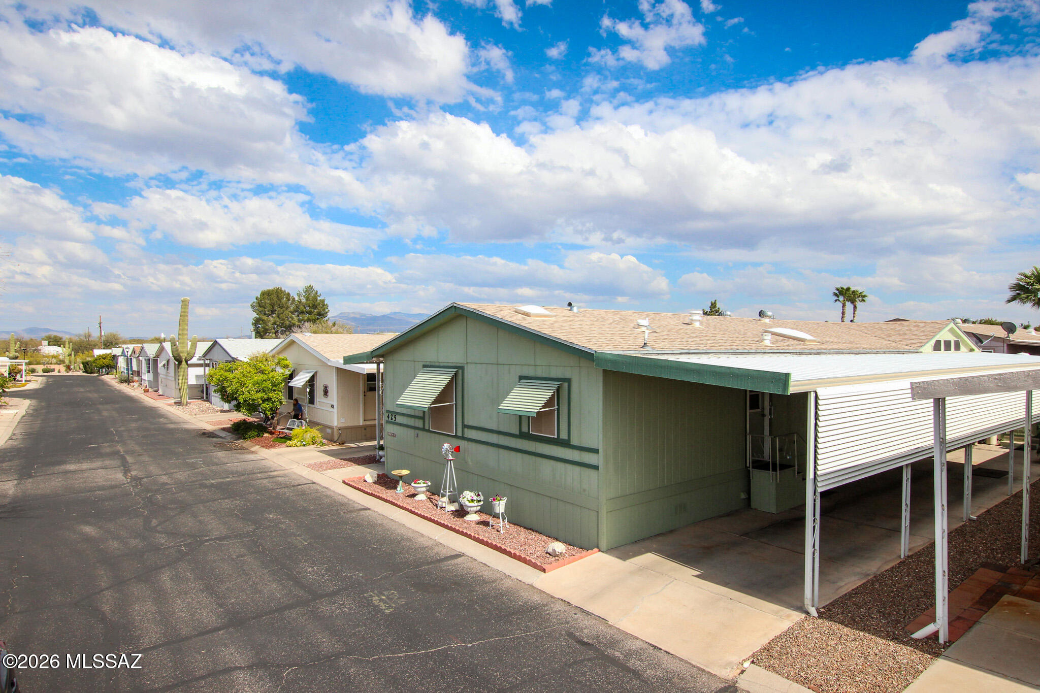 Welcome to Trails West Resort Park, a 55+ community with wonderful amenities to keep you active! Offering this beautifully inviting 3 bedroom 2 bath, 1904 sq ft Palm Harbor home. Features include a Glass inclosed Arizona Room,  (22x7) and a  (10x12) shed/workshop with electric.  Vaulted ceilings, split-floor plan, with large living area and family room. A charming kitchen with ample cabinet/counter space, pantry and gas range. The spacious primary suite boasts a large walk-in closet and en-suite with a walk-in shower and additional linen storage. This is a manufactured home park sale includes personal property only; land does not convey. Buyer must complete the community application process and receive corporate office approval prior to making an offer. Welcome Home! Ammenities: Pools, jacuzzies, shuffle board, firepits, grills, fitness room, clubhouse, library, pool tables, and a dog park,