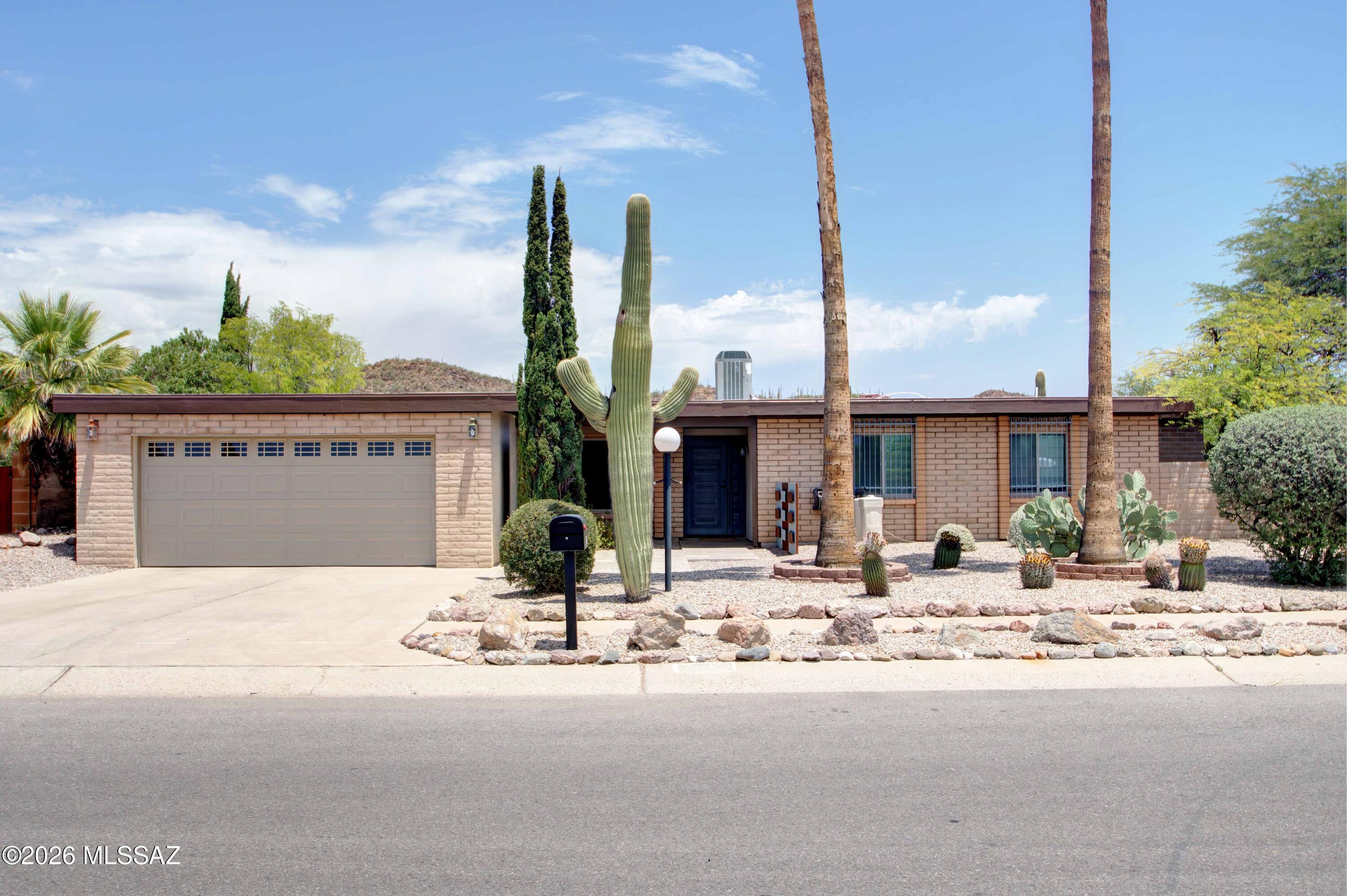 Discover this beautifully updated 3-bed/ 3-bath home nestled in a quiet, established SW Tucson neighborhood. Conveniently located near shopping, dining, entertainment, with easy access to I-19. Inside find modern updates throughout, including a stylish kitchen, renovated bathrooms, & a versatile bonus room that can serve as a family room or office space. Thoughtfully designed floor plan features two primary suites, providing flexible living options or added privacy. Many custom features have to be seen to believe. Step outside to your private backyard oasis, with mountain views. Landscaped outdoor space designed to relax & entertain, featuring sparkling pool & covered ramada enhanced by distinctive metal work. Enjoy Tucson sunsets from the comfort of your own backyard retreat.