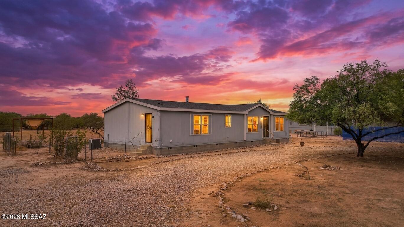Enjoy years of energy savings with OWNED SOLAR on this beautiful 3-bed, 2-bath home on nearly an acre (.972 acres)! A spacious living room with a cozy fireplace welcomes you inside, while the extended kitchen impresses with an island, desk nook, and ample cabinet space. The master suite offers a walk-in closet plus a separate tub and shower. Dual-pane windows keep things efficient throughout, and the roof was replaced in 2022 for extra peace of mind. Washer, dryer, and refrigerator all convey! Outside, the fully fenced backyard includes a dog run, perfect for pets. Schedule your showing today!