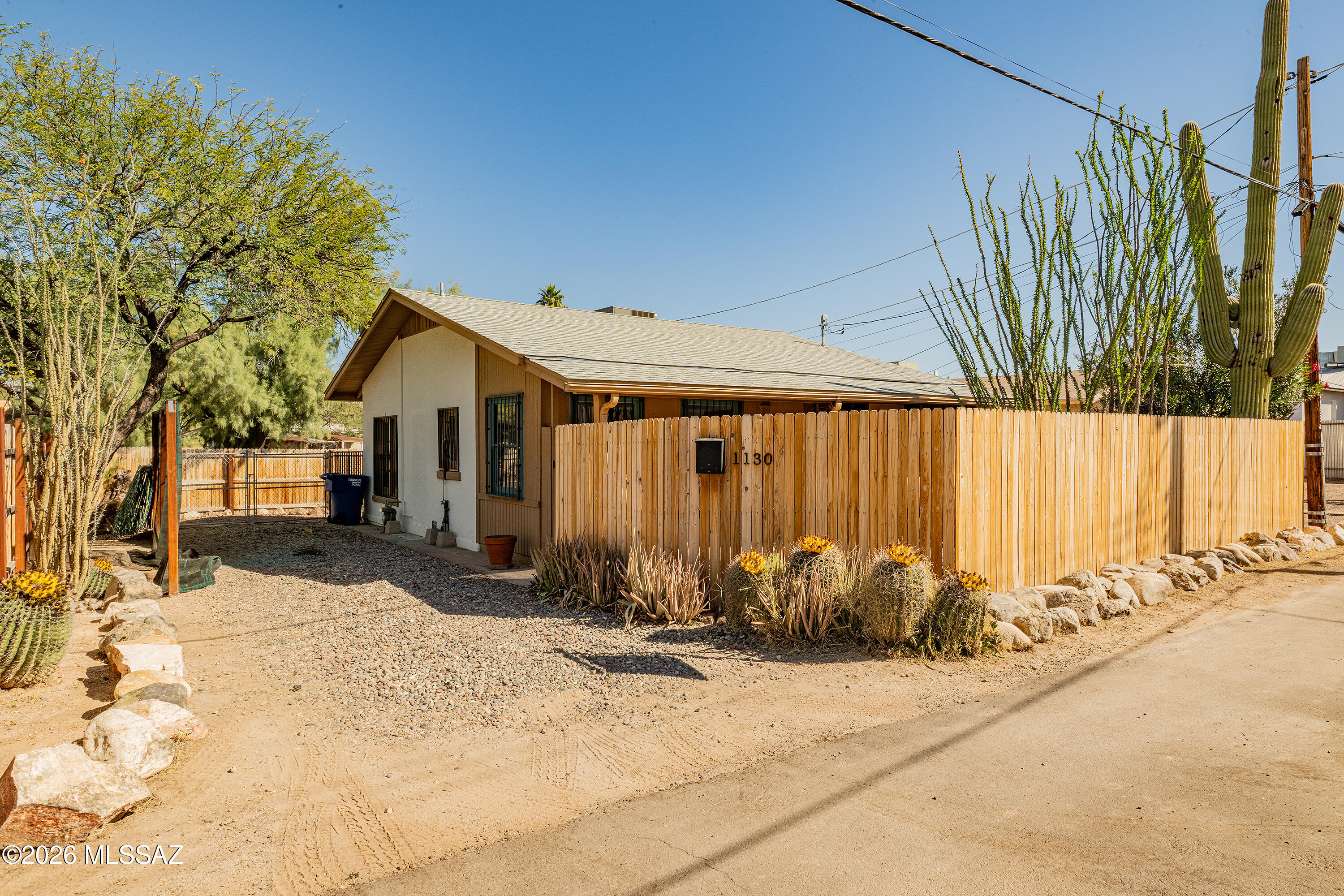 Own a charming piece of Tucson history in one of the city's most sought-after neighborhoods, known for its blend of urban convenience and timeless character. This delightful 1923 bungalow has been lovingly cared for. Hidden off a quiet street, and only a 3 min walk to Sunshine Wine, or Screwbean Brewery. Enjoy morning coffee on the inviting screened-in porch or unwind in the private, low-maintenance yard. Hard wood floors throughout. Major system upgrades provide exceptional value: roof under 10 years old, brand-new heating and cooling system (less than one year old), cast iron sewer lines replaced in 2016, and new Viega piping and fittings for hot and cold water installed in 2022. Full of warmth, character, and smart updates this adorable bungalow is ready to welcome its next chapter.
