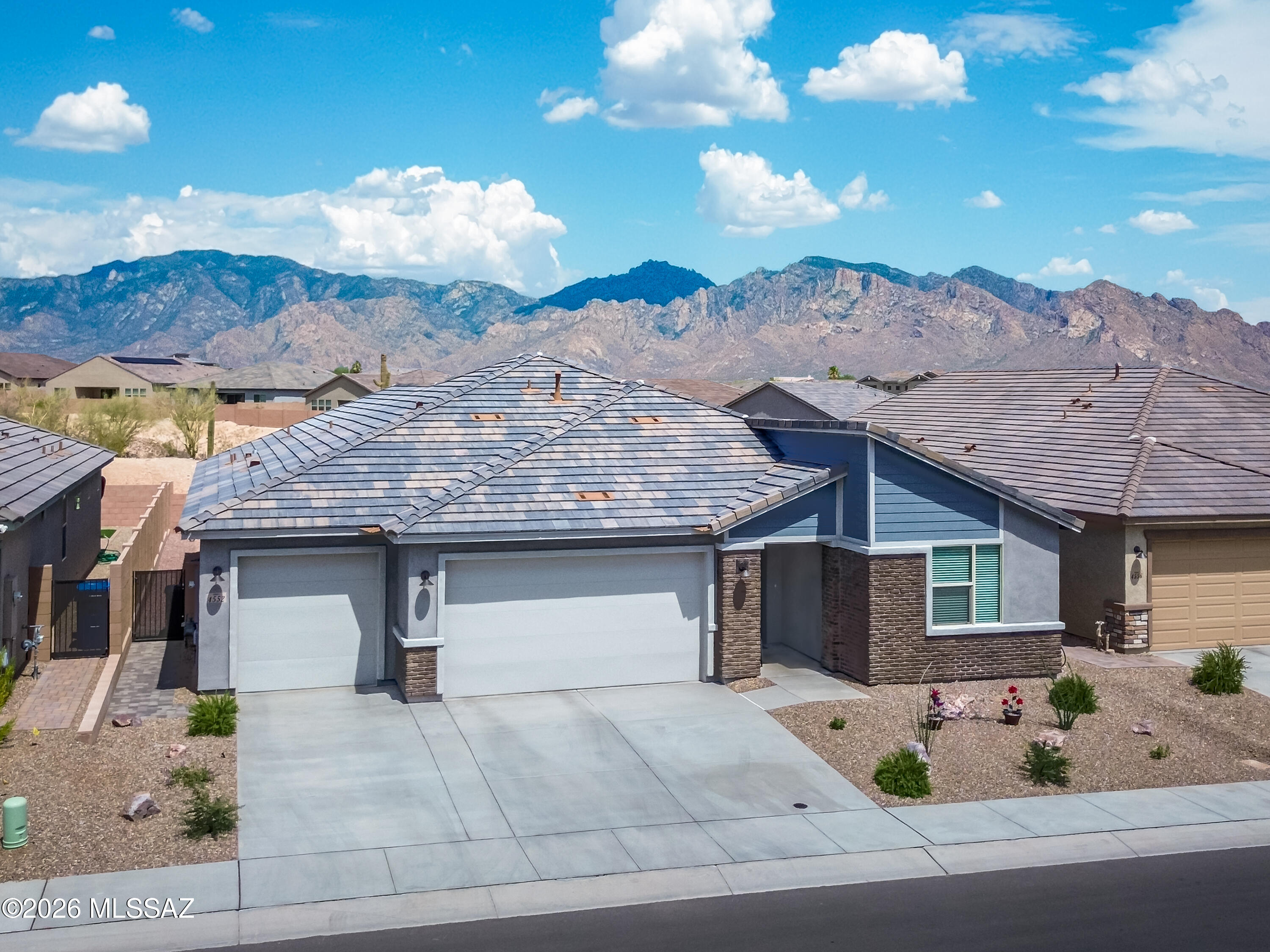 Experience modern Arizona living in this nearly new Mattamy-built Blush model located in the sought-after Montelena
community. Offering 2,471SF of thoughtfully designed living space, this one-year-old home features an open great room concept perfect for both everyday living & entertaining. The spacious floor plan includes 3BR, 2.5BA + versatile study/office ideal for working from home or creating a private retreat. The beautifully appointed kitchen features 42'' cabinets, quartz counters & large center island and flows seamlessly into the expansive great room & dining area, creating a bright & welcoming atmosphere. Step outside to enjoy the covered patio with desirable east-facing Catalina Mountain views -- the perfect setting for relaxing mornings and shaded afternoon entertaining. The professionally finished backyard showcases low-maintenance artificial turf, firepit and attractive brick pavers for easy outdoor living year-round. Additional highlights include a 3-car garage with epoxy flooring & mini-split, laundry room with utility sink,
contemporary finishes & the peace of mind that comes with owning a nearly new home. Combining comfort, style & scenic desert beauty, this exceptional Montelena residence is ready to impress.