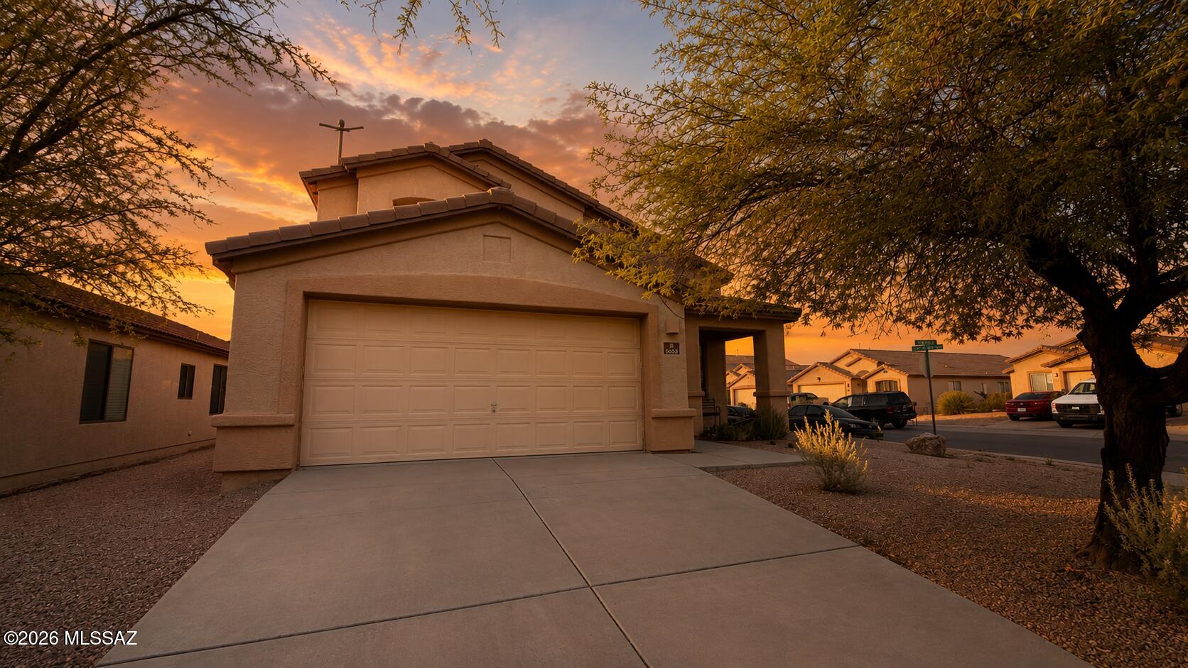 Welcome home to this spacious 4-bedroom, 2.5-bath home in the desirable Star Valley community! Offering 2,289 sq. ft., this thoughtfully designed floor plan features an open great room, an eat-in kitchen with breakfast bar and pantry, a generous primary suite with a walk-in closet and en suite bath, and a private, block-fenced backyard with a covered patio perfect for relaxing or entertaining. Conveniently located near parks, schools, shopping, dining, and easy access to I-19 and Downtown Tucson. Even better, the seller is willing to credit buyers toward repairs, closing costs, or interest rate buy-downs with an acceptable offer, creating an incredible opportunity to make this home your own. Note: The property is currently being painted inside and repaired.