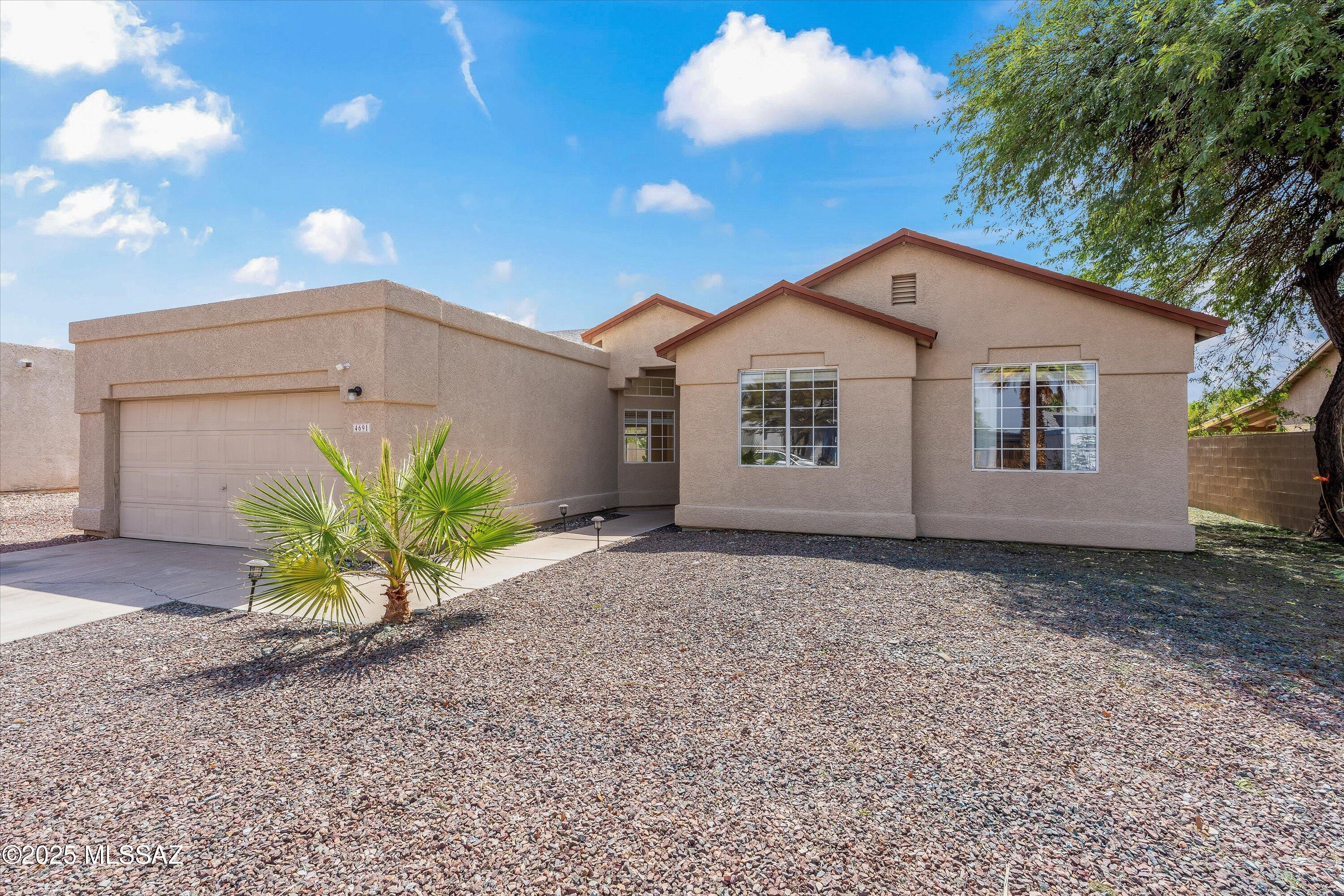 Welcome home to this beautifully updated 3-bedroom, 2-bath East Side retreat in the highly sought-after Saguaro Canyon community. Perfectly located near shopping and dining, this bright and open home offers both comfort and convenience. Step inside to find newer flooring, paint, cabinetry, granite countertops, and HVAC, all thoughtfully maintained. The spacious living area flows effortlessly into the kitchen and dining spaces, ideal for entertaining family and friends. The primary suite features a generous walk-in closet and a private bath with a dual vanity and separate shower—your own relaxing getaway. Large windows fill the home with natural light year-round, complemented by blinds to keep things cool and comfortable. Step outside to your private backyard oasis- complete with a sparkling blue pool, low-maintenance astroturf, and a new concrete pad ready for your gazebo or outdoor lounge setup. Whether you're hosting a BBQ or enjoying a quiet evening under the stars, this backyard is designed for year-round enjoyment. With a 2-car garage and meticulous care throughout, this home truly has it all. Come see why this East Side gem stands out, schedule your showing today!