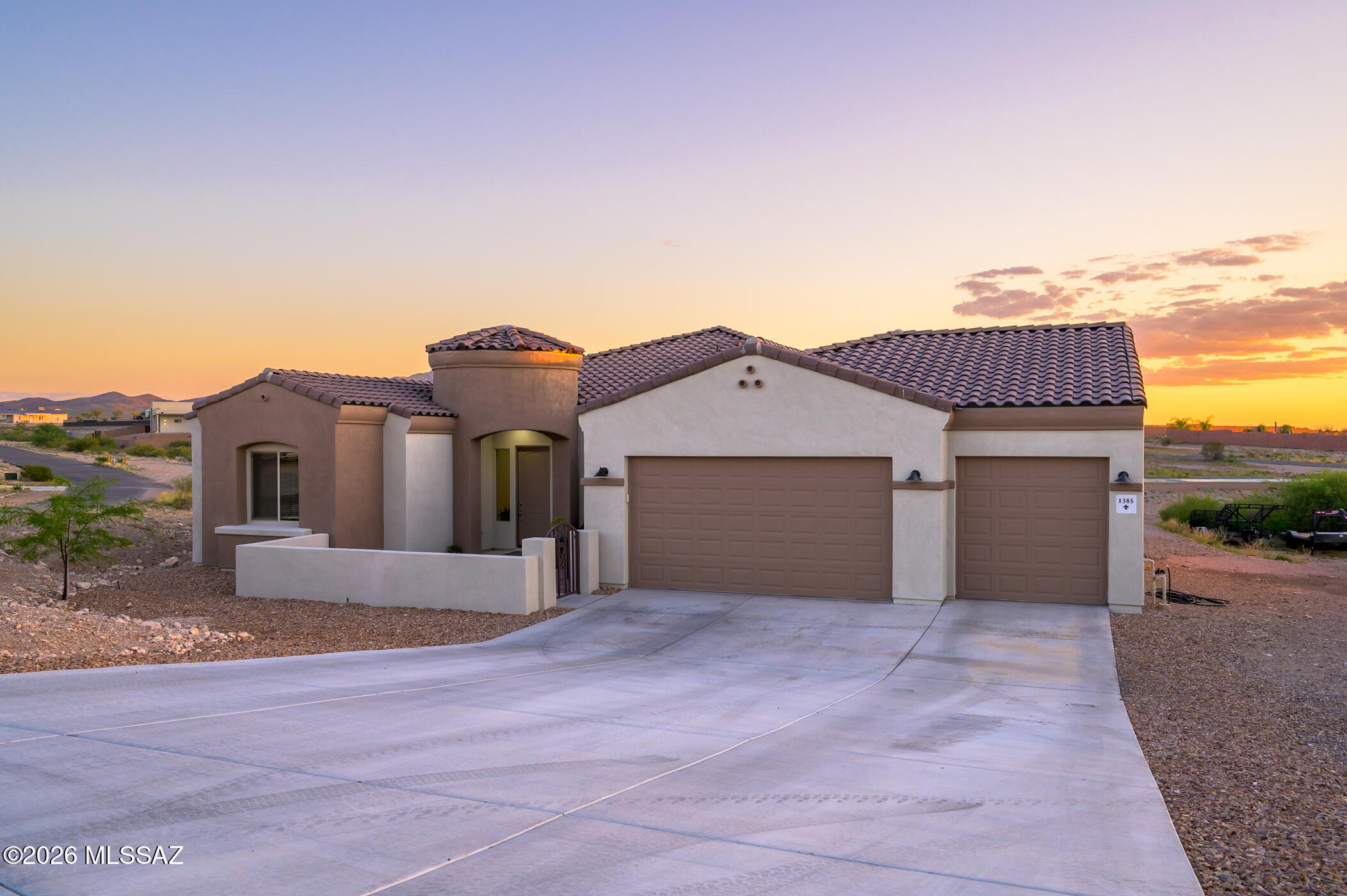 Beautiful newer construction home on nearly an acre in sought-after Vail! This spacious 3 bedroom + den, 2 bathroom home offers 2,439 sq ft of modern living with an open-concept layout, high ceilings, abundant natural light, tasteful finishes throughout and 3 car garage with a 4 foot extension. The versatile den is perfect for a home office, playroom, or guest space. Enjoy a large kitchen opening to the great room, ideal for entertaining. Situated on a generous .90 acre lot with breathtaking mountain and desert views, there is plenty of room for RV parking, toys, or future outdoor additions. Experience peaceful living with space and privacy while still being conveniently located near Vail schools, shopping, dining, and I-10 access.