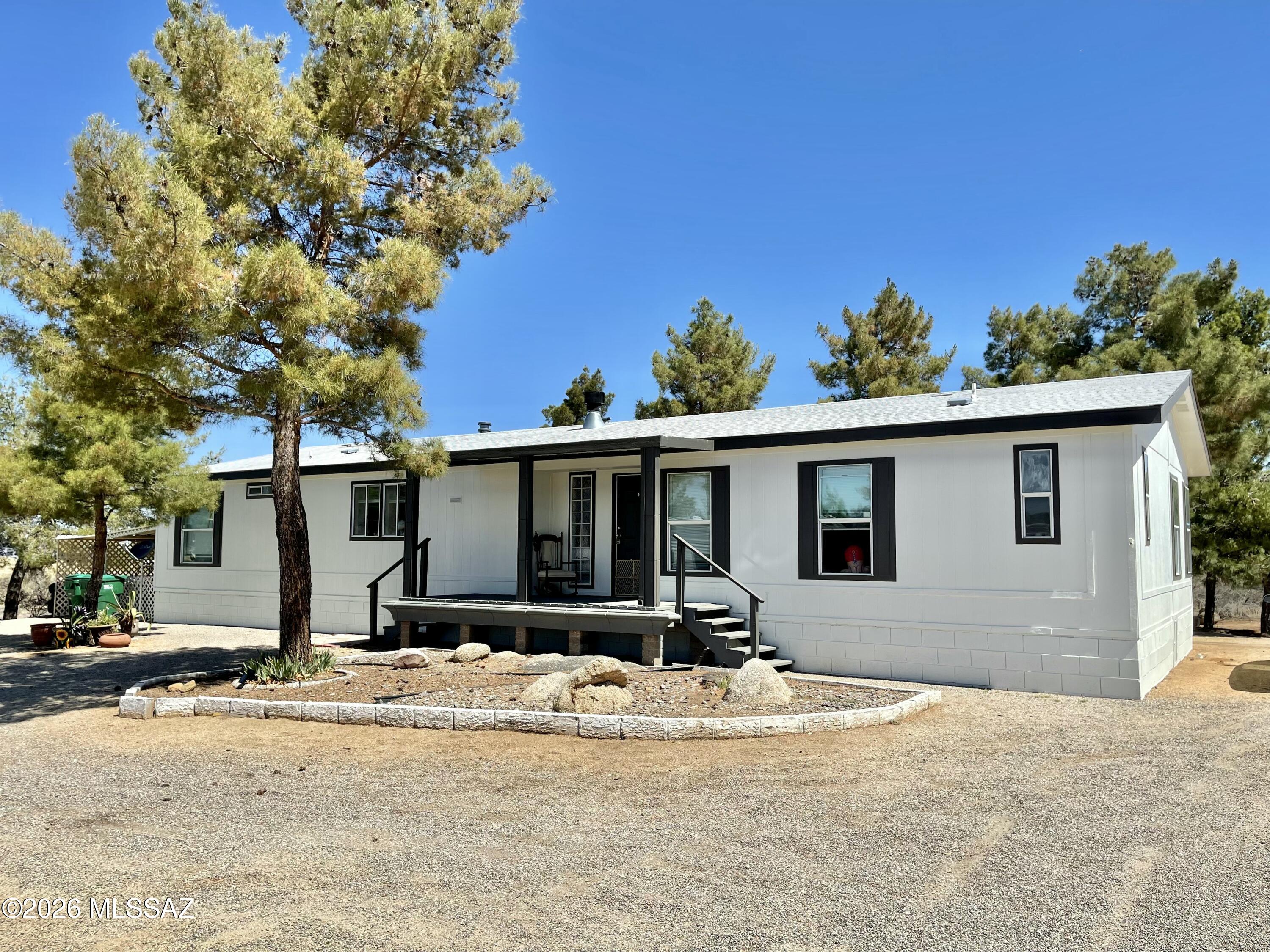 Enjoy privacy, outdoor space, and sunset views at this incredible 3-bed 2-bath manufactured home with A/C on a 3.3 acre lot. Home will be availabel to rent in early July, after current tenant moves out.

The interior features new flooring, remodeled bathrooms with tiled showers, a large kitchen with pantry, and an extra room that could be used as an office/bedroom. The huge backyard borders state land and features a large outdoor covered back deck, lots of space for parking, and additional storage sheds. Home uses propane. Schedule a showing today - this won't last long!

Please text property manager with home address and your email for application, deposit info, and to schedule a showing.