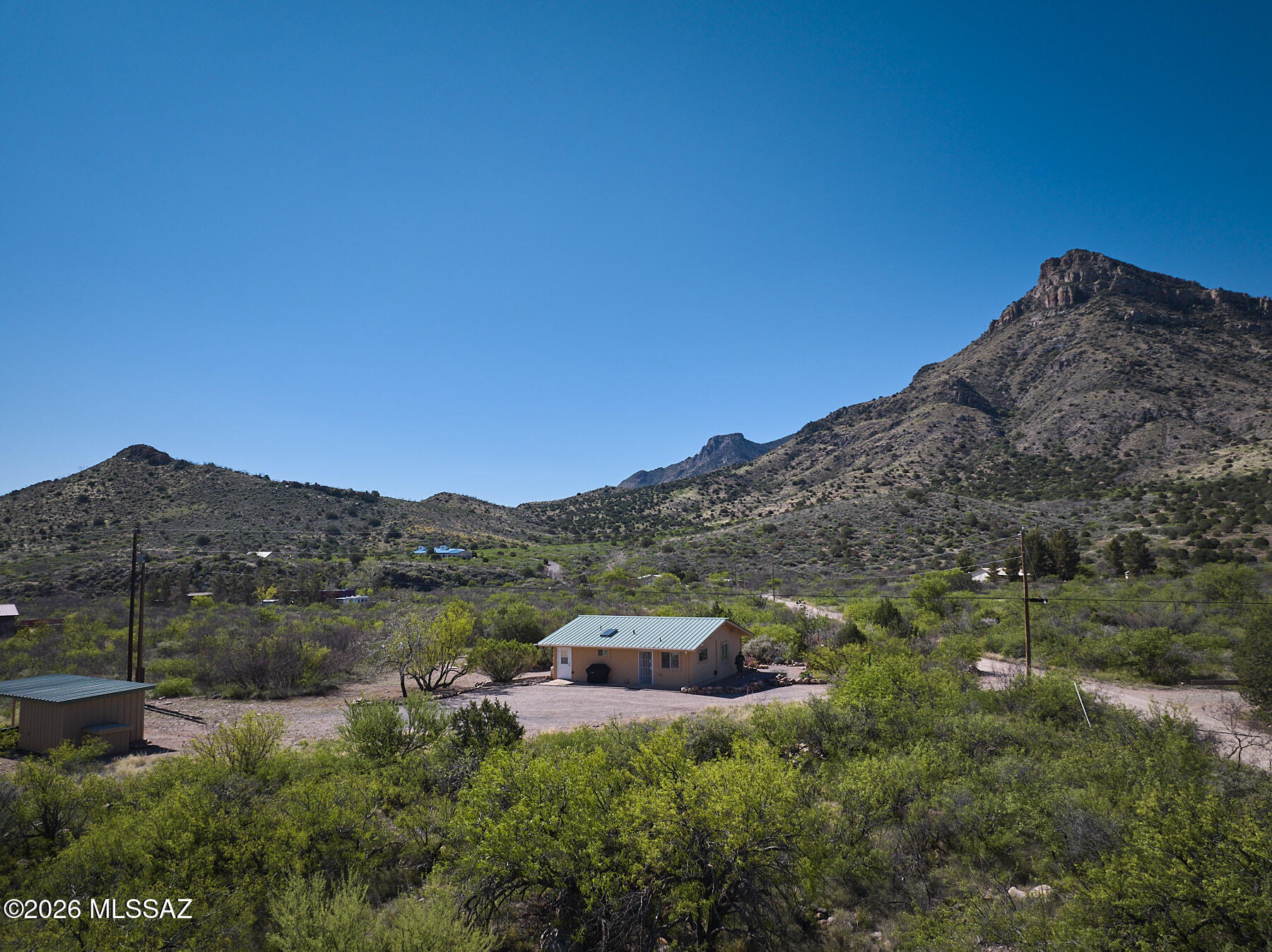 Move-in ready 2 bed, 1 bath home on 4.3 acres with stunning
mountain views is just a short walk to downtown Portal. Built to
last in 2010 with durable Structural Insulated Panel construction
and metal roof. Thoughtfully updated in 2023 along with a kitchen
and bathroom remodel with additional lighting, new appliances,
cabinetry and kitchen island offering additional
workspace/storage, along with fresh paint throughout. Spacious
great room, primary suite, and 2 nd bedroom feature cathedral
ceilings with exposed beams. Energy-efficient windows and mini-
split units for heating and cooling mean you will always be
comfortable. Enjoy birding from your own yard with feeding
stations, water feature, and shaded porches. Includes private
well, insulated metal outbuilding with carport, s