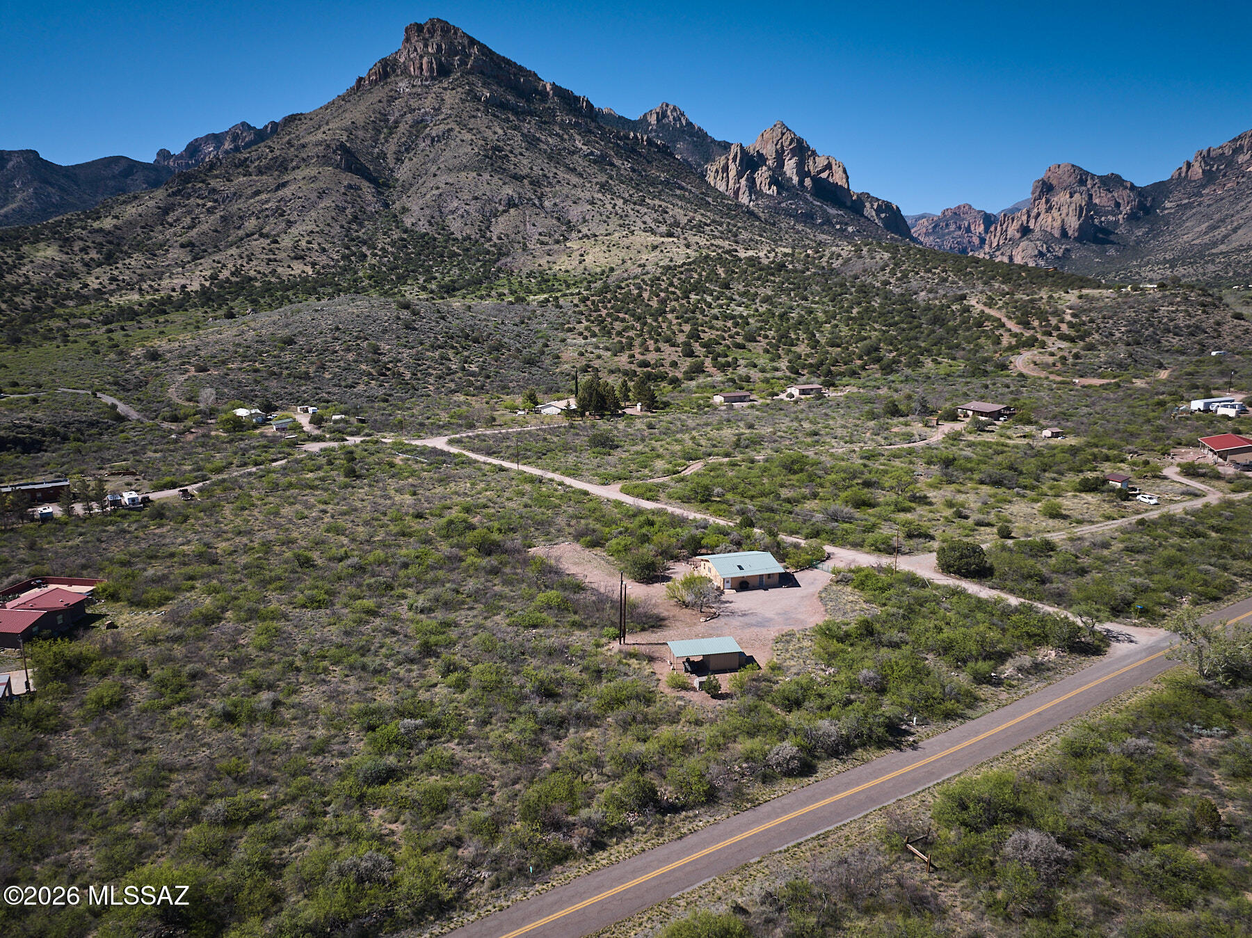 Move-in ready 2 bed, 1 bath home on 4.3 acres with stunning
mountain views is just a short walk to downtown Portal. Built to
last in 2010 with durable Structural Insulated Panel construction
and metal roof. Thoughtfully updated in 2023 along with a kitchen
and bathroom remodel with additional lighting, new appliances,
cabinetry and kitchen island offering additional
workspace/storage, along with fresh paint throughout. Spacious
great room, primary suite, and 2 nd bedroom feature cathedral
ceilings with exposed beams. Energy-efficient windows and mini-
split units for heating and cooling mean you will always be
comfortable. Enjoy birding from your own yard with feeding
stations, water feature, and shaded porches. Includes private
well, insulated metal outbuilding with carport, s