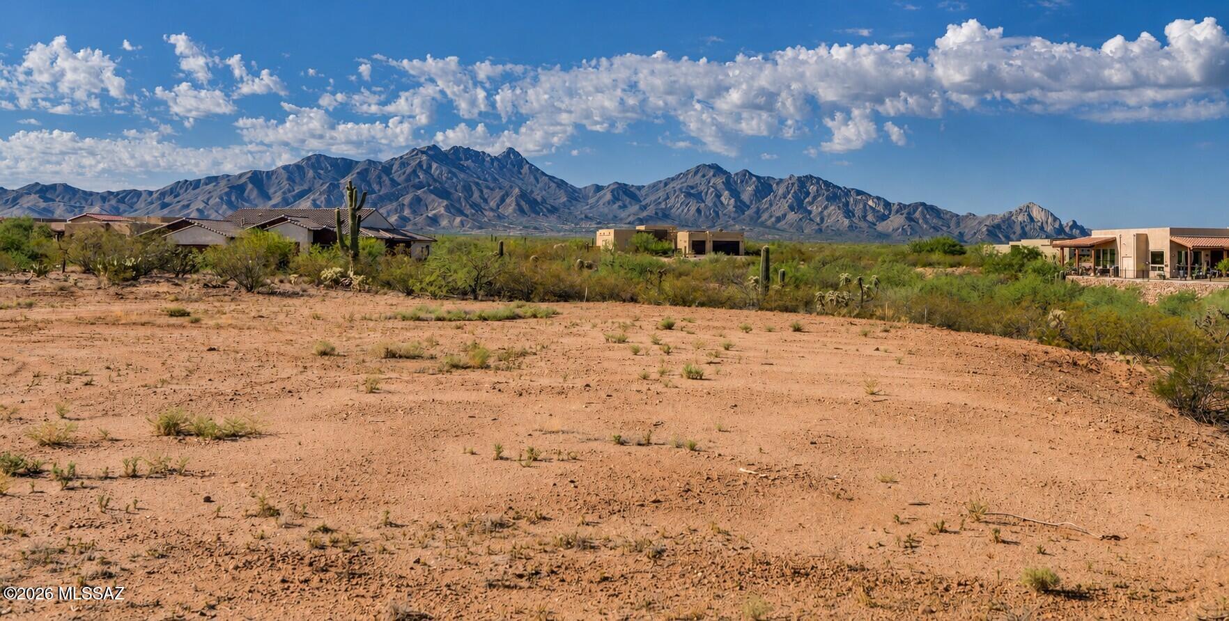 Build your dream home on this exceptional 1.53-acre homesite in the prestigious gated Stone House community. Situated on a quiet cul-de-sac, this premium lot offers a generous building envelope with a graded building pad and driveway already in place. Take in breathtaking panoramic views of 
the Santa Rita Mountains and surrounding Sonoran Desert landscape. All utilities are available at the lot line, including natural gas and sewer. Previously prepared conceptual floor plans and exterior elevations for a proposed 3,297 sq ft custom residence are available (see photos), providing an excellent starting point for designing your dream home. Enjoy the peace and tranquility of this exclusive custom-home community featuring large estate-sized homesites, abundant natural open space, proposed walking trails, and 24/7 gated access. Conveniently located just minutes from shopping, restaurants, golf, hiking, medical offices, and I-19, you'll enjoy the perfect balance of privacy and accessibility. Stone House was thoughtfully designed to preserve the natural desert landscape and wildlife corridors, with opportunities to enjoy walking throughout the community.
If you've been searching for the ideal location to build your forever home, this outstanding homesite deserves your attention.