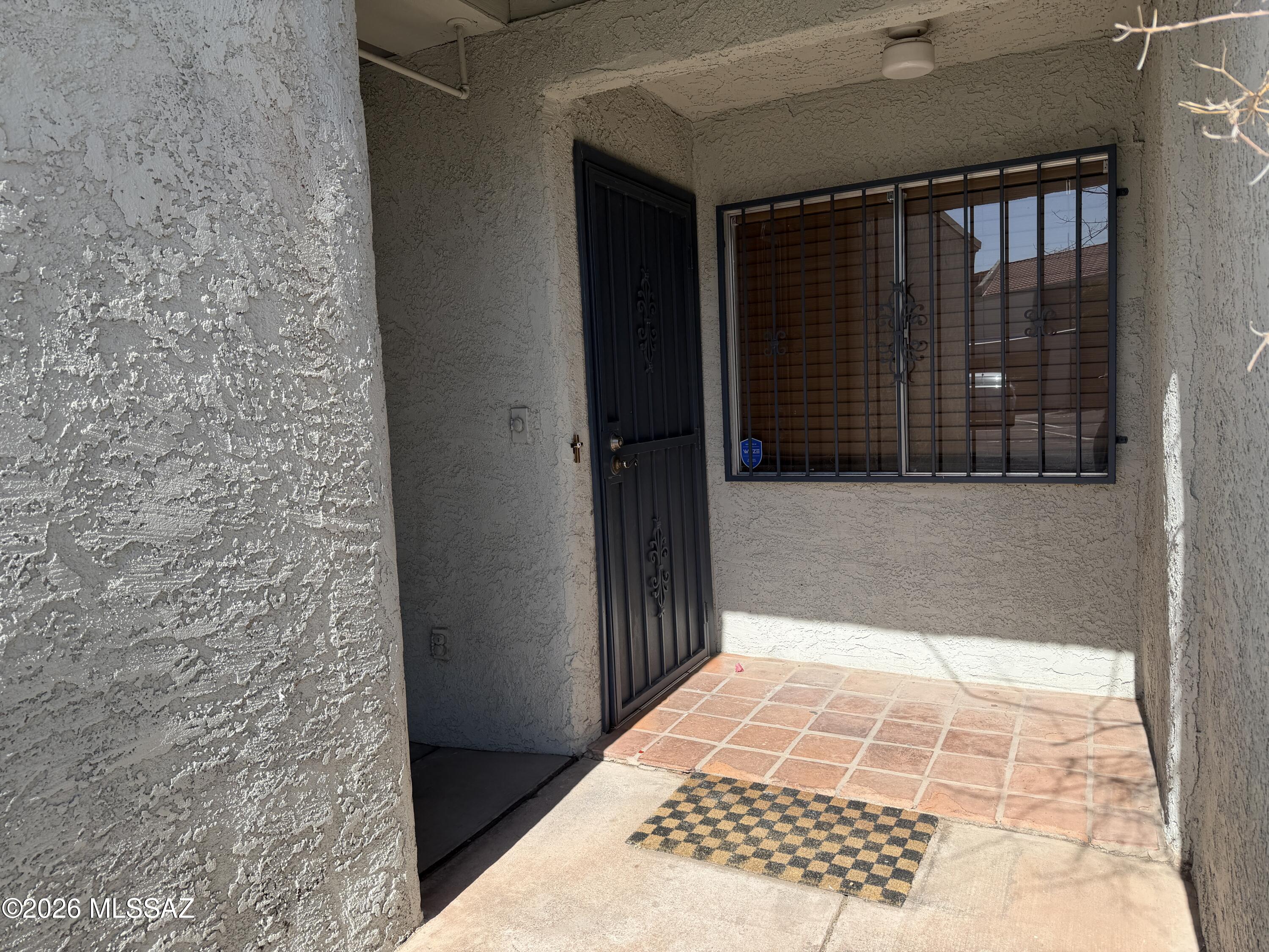 Nestled in the scenic Tucson Mountains, this beautifully updated 2-bedroom, 2.5-bathroom townhome offers the perfect blend of desert serenity and city convenience. Step inside to find a freshly updated interior featuring brand-new carpet and fresh paint throughout. Plant lovers will fall in love with the home's centerpiece: a unique interior atrium finished with classic Saltillo tile that bathes the living space in gorgeous natural light. The spacious master bedroom serves as a private retreat, complete with its own balcony showcasing stunning, unobstructed mountain views. As a resident, you'll also enjoy access to premium community amenities, including a sparkling pool and a recreation center. The prime westside location places you just minutes from I-10. Owner Managed
