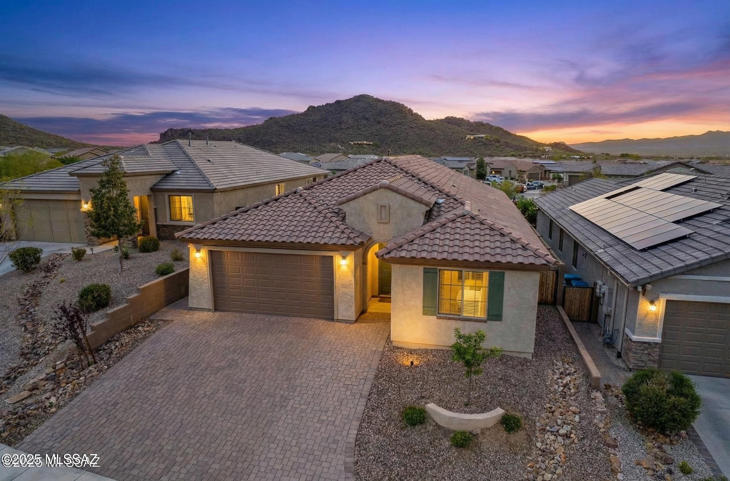 Welcome to this 2020-built home in the gated community of Lazy K Bar Ranch at the base of Sombrero Peak. This 2,271 sq ft home features 4 bedrooms, 3 bathrooms, and a versatile flex room ideal for an office, gym, or playroom.The open floor plan offers a bright and spacious layout, connecting the living, dining, and kitchen areas. The kitchen includes quartz countertops, stainless steel appliances, a walk-in pantry, and a large island with breakfast bar--perfect for everyday living and entertaining. Upgrades include plantation shutters, updated flooring, reverse osmosis drinking water system, and a whole-house water softener.Enjoy Arizona living in the low-maintenance backyard with pavers, gravel, and a covered patio. Take in stunning mountain views and beautiful sunsets right from your own home. Located in a secure gated community with easy access to nearby hiking trails, this home offers privacy, comfort, and a great connection to the outdoors.