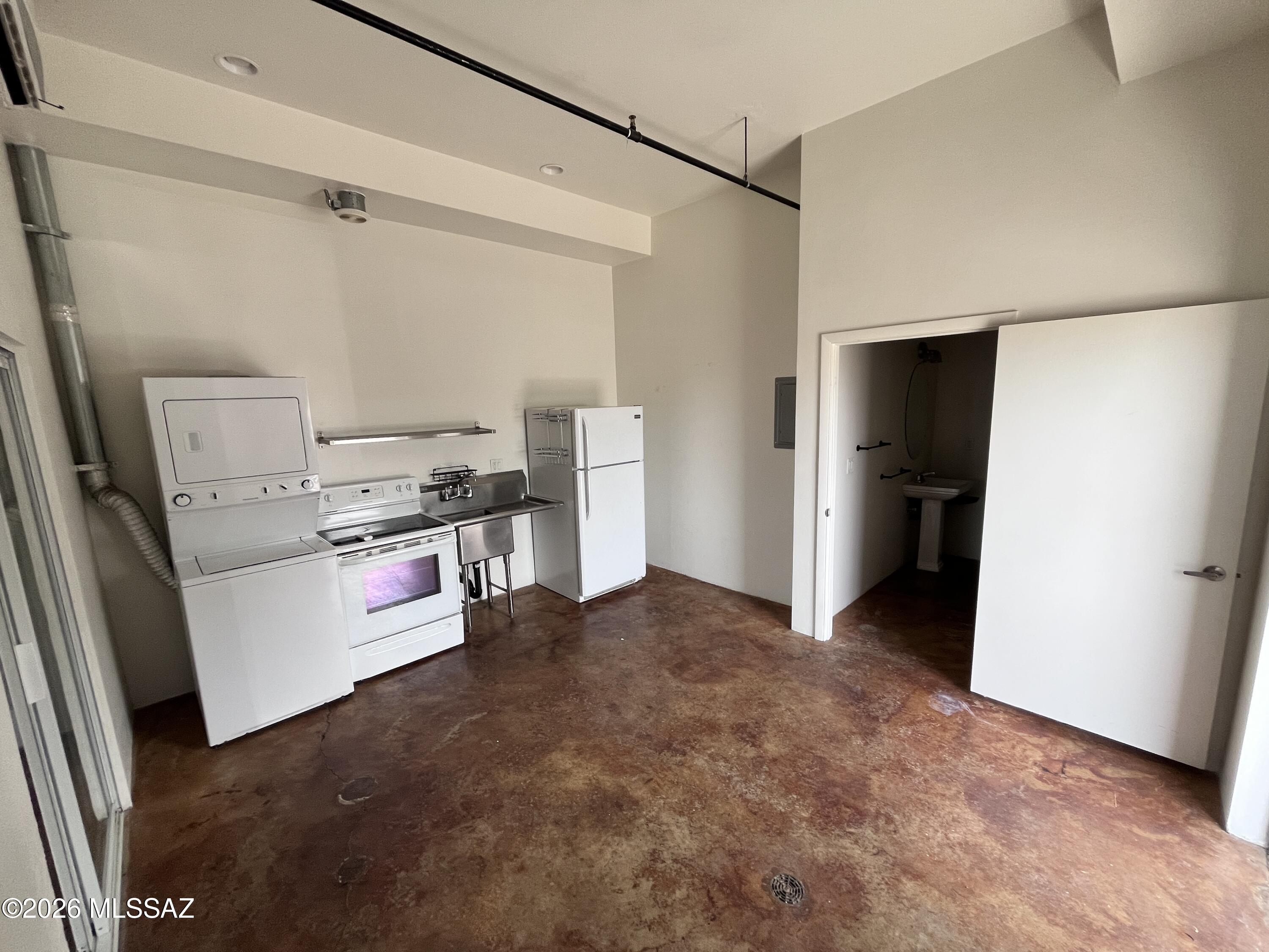 This modern industrial property is designed for living, working, and entertaining. Features include beautiful concrete floors, soaring ceilings, and stainless steel appliances, including washer & dryer. The open studio layout offers flexible space for living, sleeping, and a home office or creative setup.

Enjoy the gated community which features indoor and outdoor common areas! Indoor area has a pool table and original art, adding to the unique, creative vibe of the community. Outdoor area with plenty of seating and parking. This is a one-of-a-kind space with endless possibilities in a prime location close to downtown, the U of A, and freeway access.

1 year Lease
Tenant pays electric, gas and flat $40 monthly water/sewer/trash charge
Assigned parking
Gated community