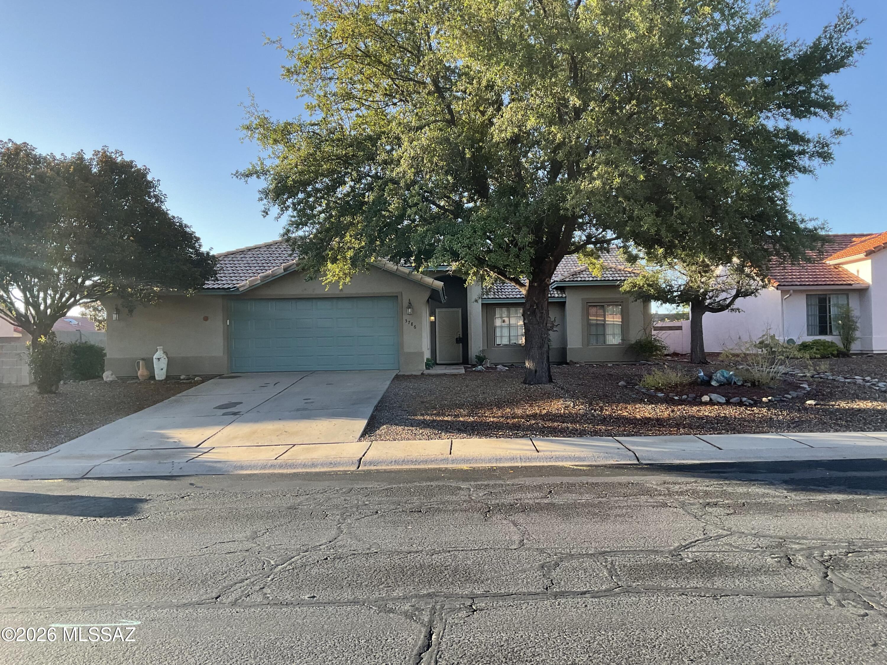 Beautiful turnkey former model home in desirable Canyon De Flores with no HOA. This 3 bedroom, 2 bath, 1,700 sq ft ranch features a bright great room floor plan with vaulted ceilings, skylights, and a well-appointed kitchen with pantry and all appliances. Easy-care front desert landscaping and a private backyard with artificial turf, desert plantings, and covered patio make outdoor living a breeze. Oversized 2.5-car garage, tile roof, block wall, and convenient location near Ft. Huachuca, schools, and shopping.