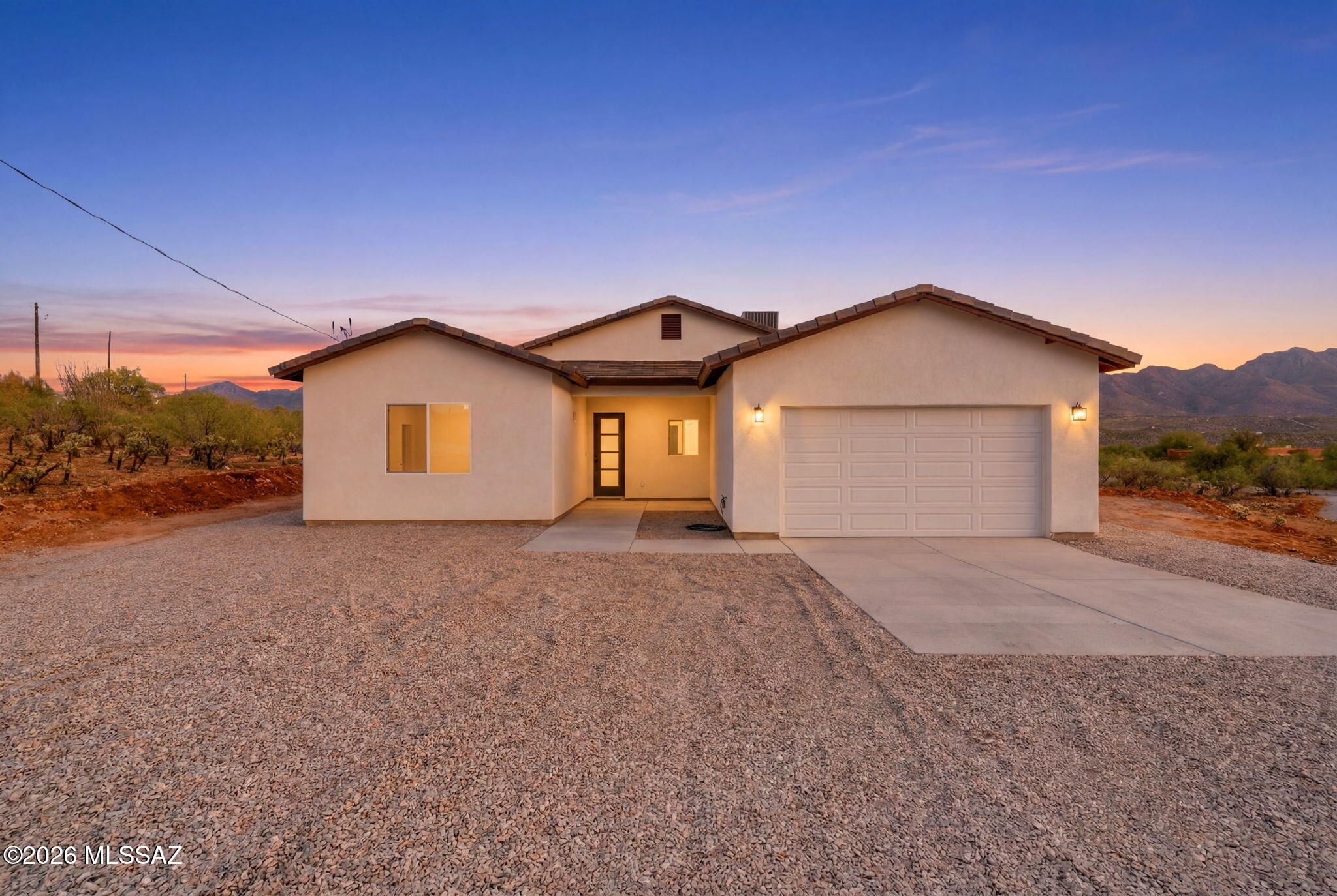 Be the first to own this beautiful brand-new home in the growing community of Rio Rico! Thoughtfully designed with modern finishes and a functional open-concept layout, this home offers the perfect blend of comfort, style, and efficiency. The spacious living area flows seamlessly into the kitchen, featuring contemporary cabinetry, ample counter space, and a welcoming atmosphere for everyday living and entertaining.

The split-bedroom floor plan provides privacy, while the primary suite offers a relaxing retreat with a generous walk-in closet and well-appointed bathroom. Energy-efficient construction, quality craftsmanship, and low-maintenance features make this home an exceptional value. Situated on a spacious lot with stunning mountain and desert views, you'll enjoy the tranquility of Rio Rico while remaining conveniently close to schools, shopping, dining, and easy access to I-19. Whether you're a first-time homebuyer, seasonal resident, or investor, this move-in-ready new construction home is an opportunity you won't want to miss!
