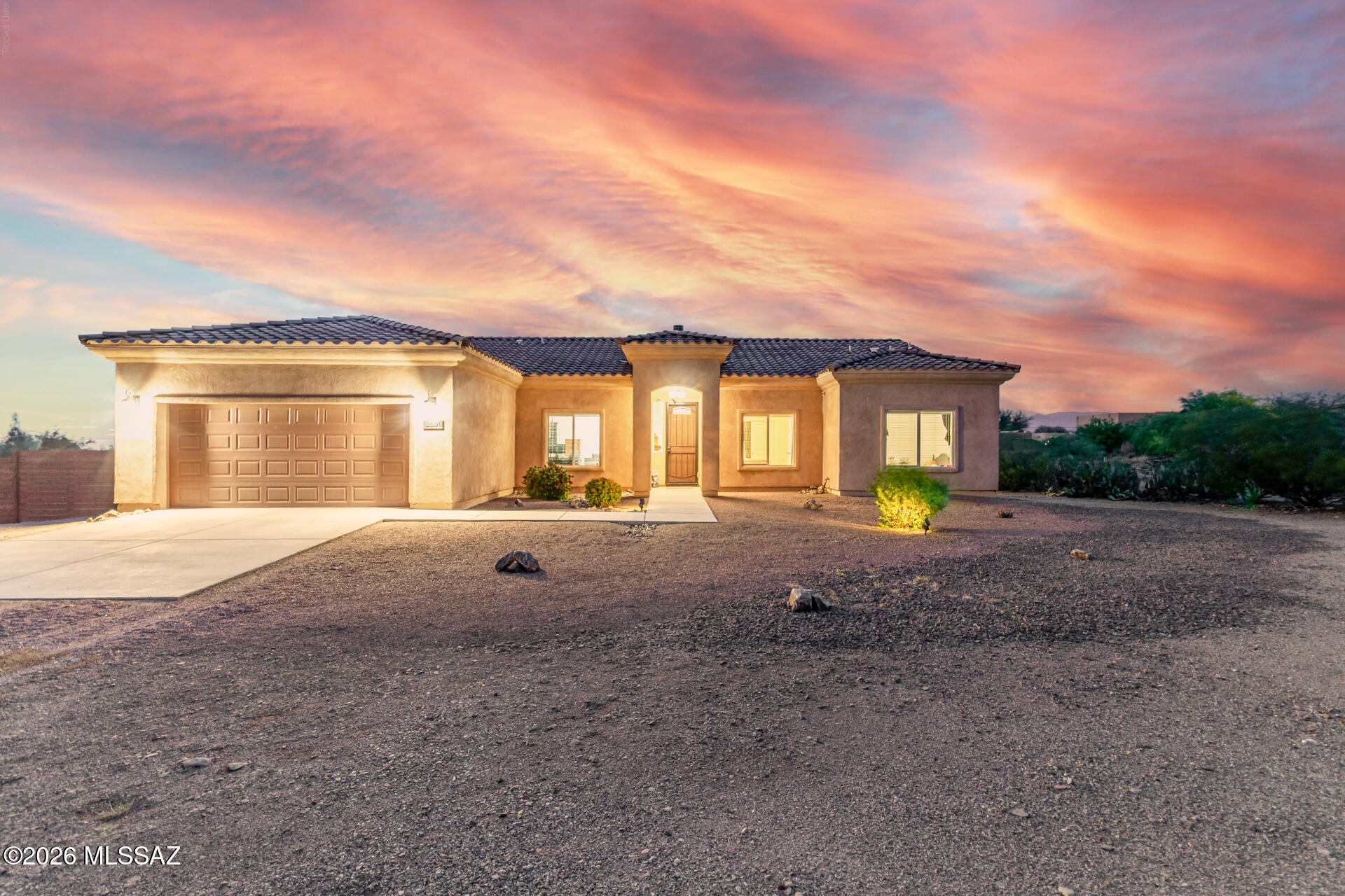 Built in 2020, this well-appointed 3-bedroom, 2-bath home with a den sits on 1.35 acres of horse property with no HOA. Extended Garage! The open-concept layout features a spacious kitchen with an island, premium granite countertops, custom cabinetry, a pot filler above the range, and black stainless steel appliances. Both bathrooms are finished with granite surfaces, while the primary suite offers dual vanities, a walk-in tiled shower, and a generous walk-in closet. The living area is anchored by a modern fireplace and opens via sliding doors to a northeast-facing covered patio, capturing natural light and expansive views. The outdoor space is designed for both function and relaxation, featuring a large patio, attached ramada, SHED and sweeping mountain views. The property is fully equipped for equestrian use. Also includes a basketball half-court and Front and back Irrigation! Extended Garage and a gas port on the patio! SHED stays!