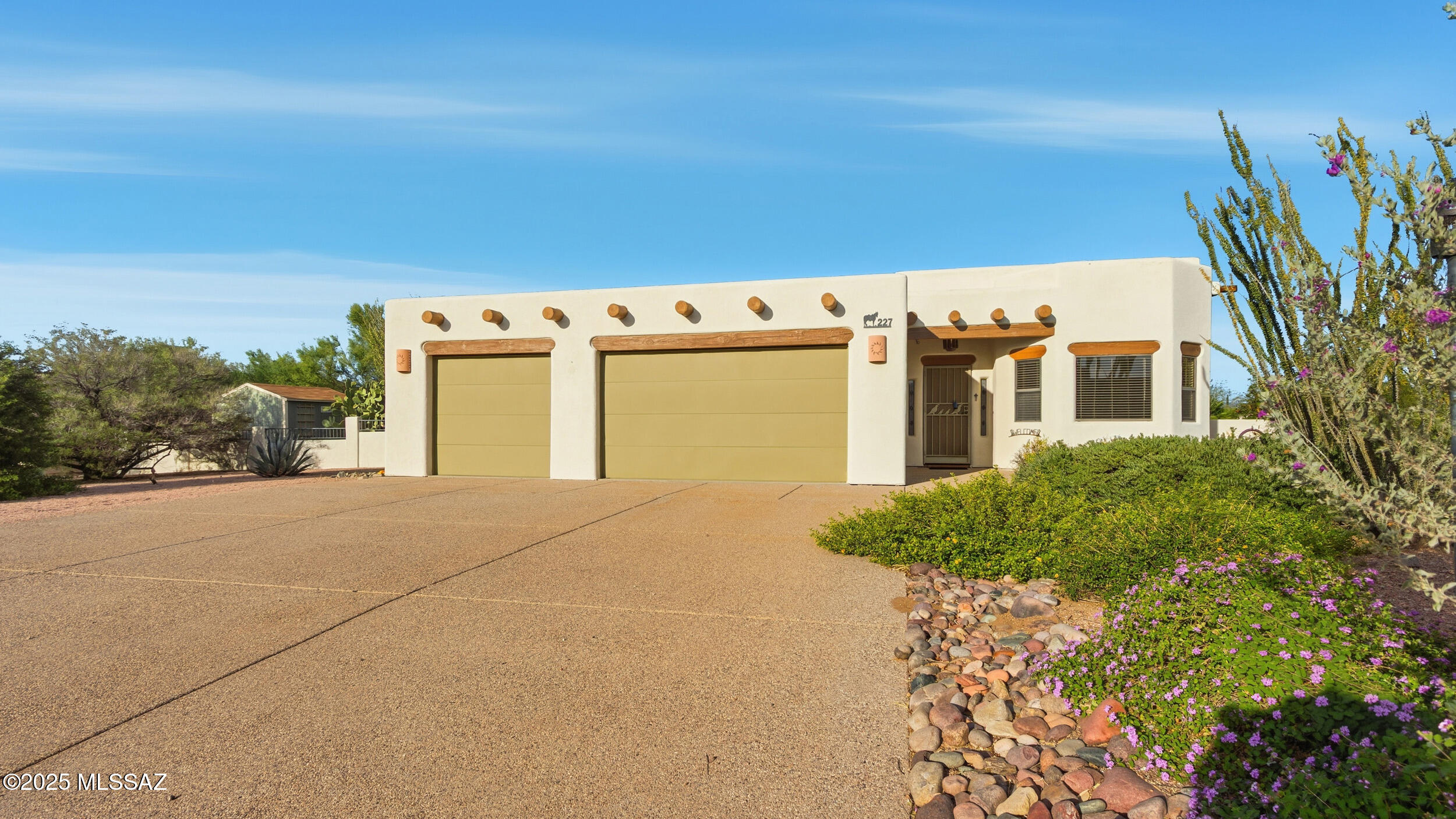 Charming Santa Fe style 3 bed 2.5 bath home with stunning views! Enjoy classic character with exposed wood beams, saltillo tile,  solid wood doors, and a cozy beehive fireplace.  Spacious living areas flow seamlessly into a bright kitchen and dining space, perfect for entertaining.  Each bedroom offers privacy and comfort, with the primary suite featuring a luxurious en-suite bath.  Relax under the gazebo and take in the desert landscaping and mountain sunsets.  A true desert retreat blending warmth, style and natural beauty.