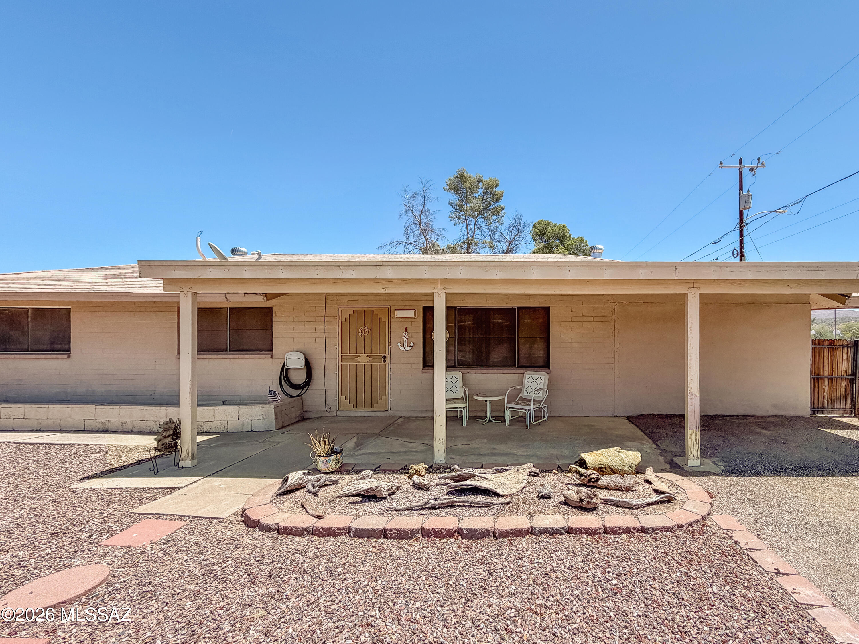 Don't miss this charming 3-bedroom, 2-bath home on a desirable corner lot right next to a city park! Inside, you'll find laminate wood flooring throughout the living areas, hallways, and bedrooms, plus beautiful tile in the kitchen and bathrooms. The spacious family room features a decorative archway, while the large kitchen and dining area provide plenty of room for gatherings and everyday living. Step outside to enjoy a full-length covered patio, privacy fencing on three sides, a large storage shed, and a covered carport. The park next door offers additional space for recreation and play. Combining comfort, privacy, and a fantastic location, this move-in-ready home is one you won't want to miss!