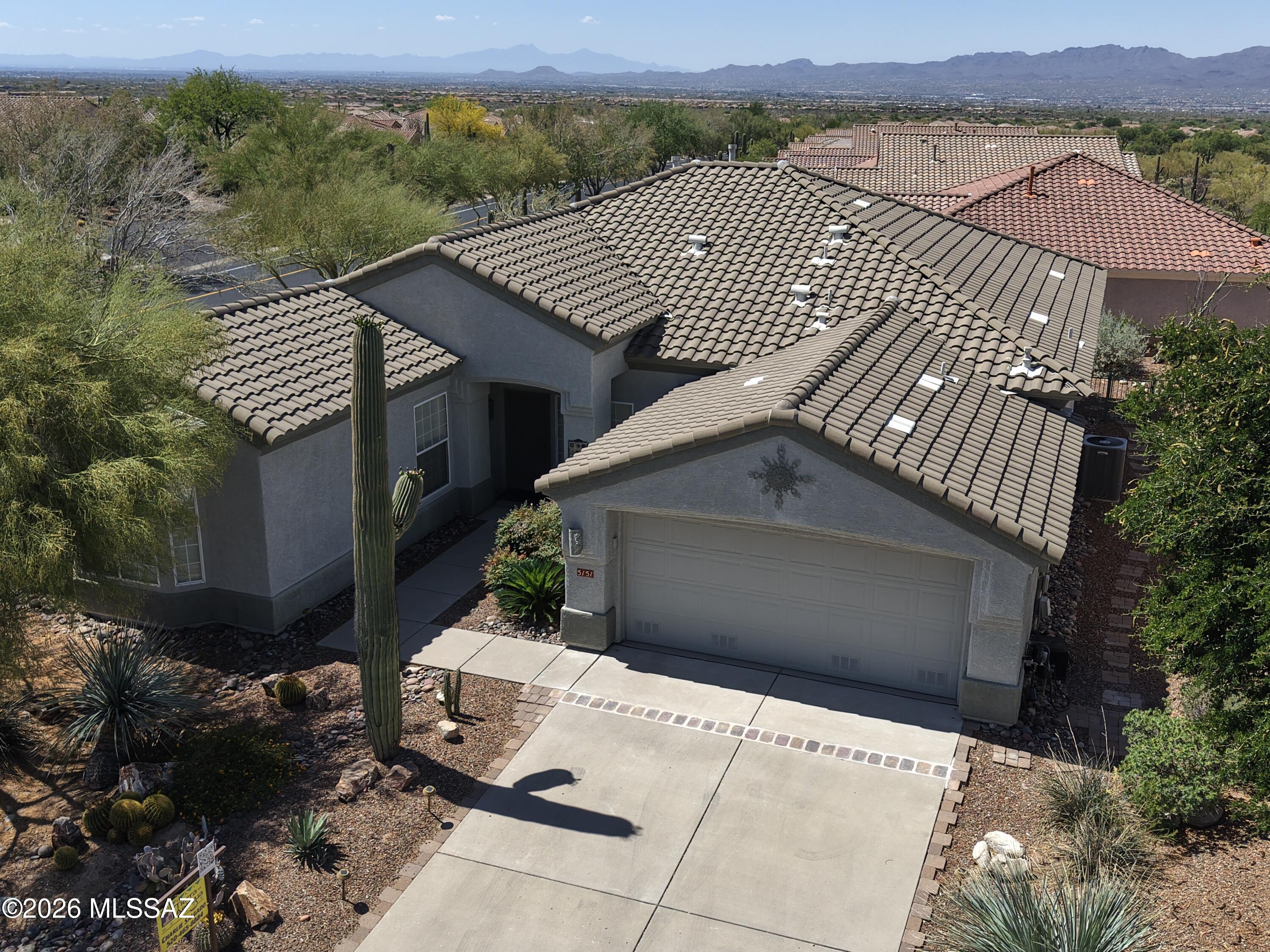 Beautifully maintained home in the desirable Dove Mountain community offering style, comfort, and access to top-tier amenities. This single-level layout features an open great room, bright modern kitchen, and split-bedroom design for added privacy. The primary suite includes a spacious bath and walk-in closet, while the low-maintenance backyard provides a peaceful covered patio ideal for relaxing or entertaining. Just minutes from the community clubhouse, where residents enjoy a state-of-the-art fitness center, pool and spa, social spaces, and scenic outdoor areas with stunning desert and mountain views. A perfect blend of convenience and resort-style living.  See the Heritage Highlands at Dove Mountain website for all that Heritage Highlands has to offer!!  Freshly Painted and new carpet!