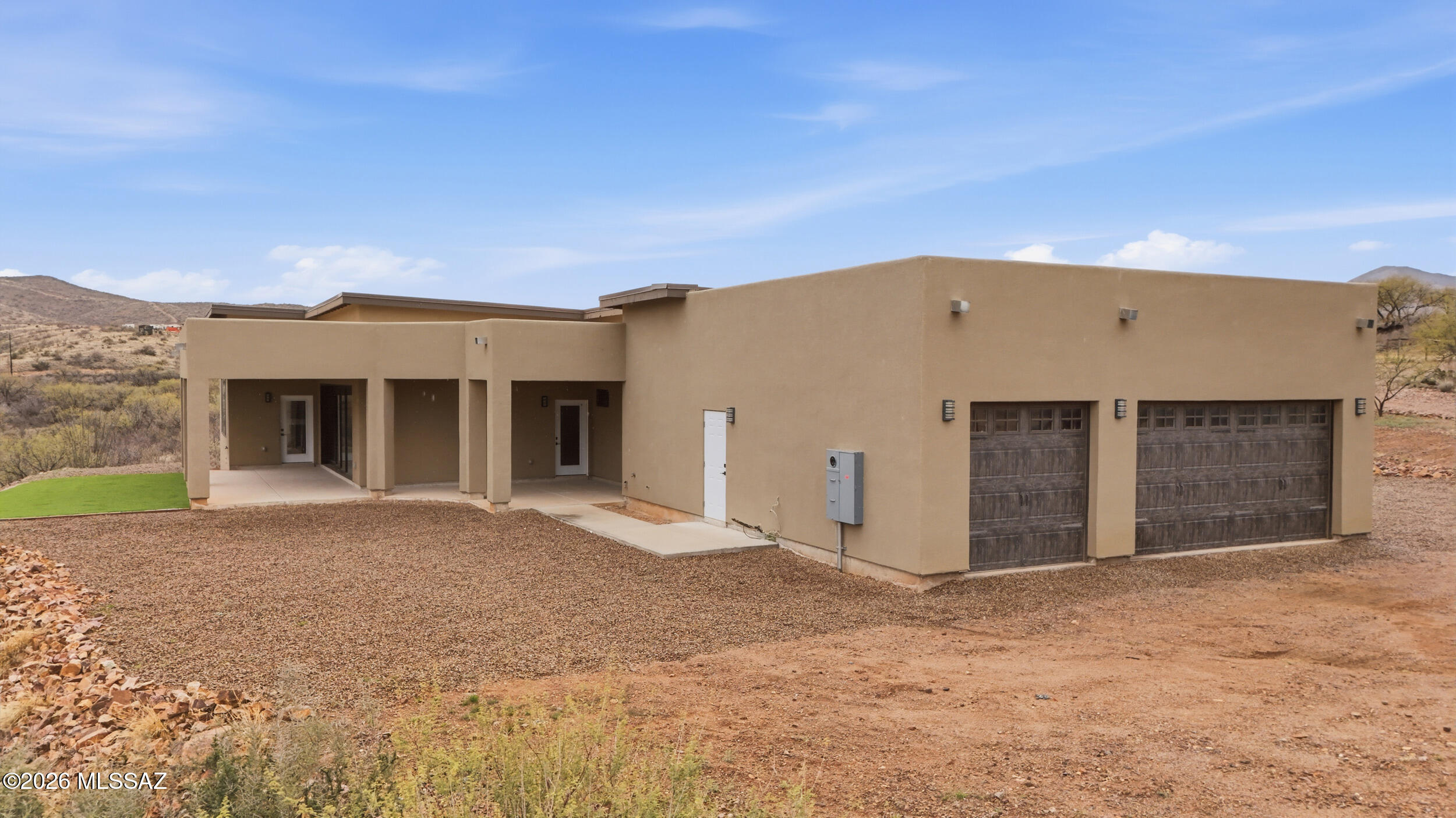 Drastically reduced to sell.  Seller will participate in buyer financing options with acceptable offer. 
 Experience wide-open living in this stunning new construction home situated on over 4 acres of pristine land -- perfect for horses, livestock, or simply enjoying your own private retreat. Take in breathtaking mountain views, glowing sunrises, and peaceful wash scenery from every angle.
This thoughtfully designed 4-bedroom, 3-bath residence includes a dedicated office Inside, soaring ceilings and an open layout create a light, airy feel. The chef-inspired kitchen features elegant quartz countertops and ample workspace, ideal for entertaining. The spacious primary suite offers a relaxing escape with two oversized walk-in closets.
Built for both beauty and durability, the home includes a long-lasting steel roof and the convenience of a shared well. And unlike many properties in the area, you'll enjoy easy access year-round -- no driving across a wash required. Less than a 10 minute drive to I10, a 30 minute drive to downtown, and within 20 minutes from Sonoita. 

Don't miss your chance to own this exceptional desert retreat.