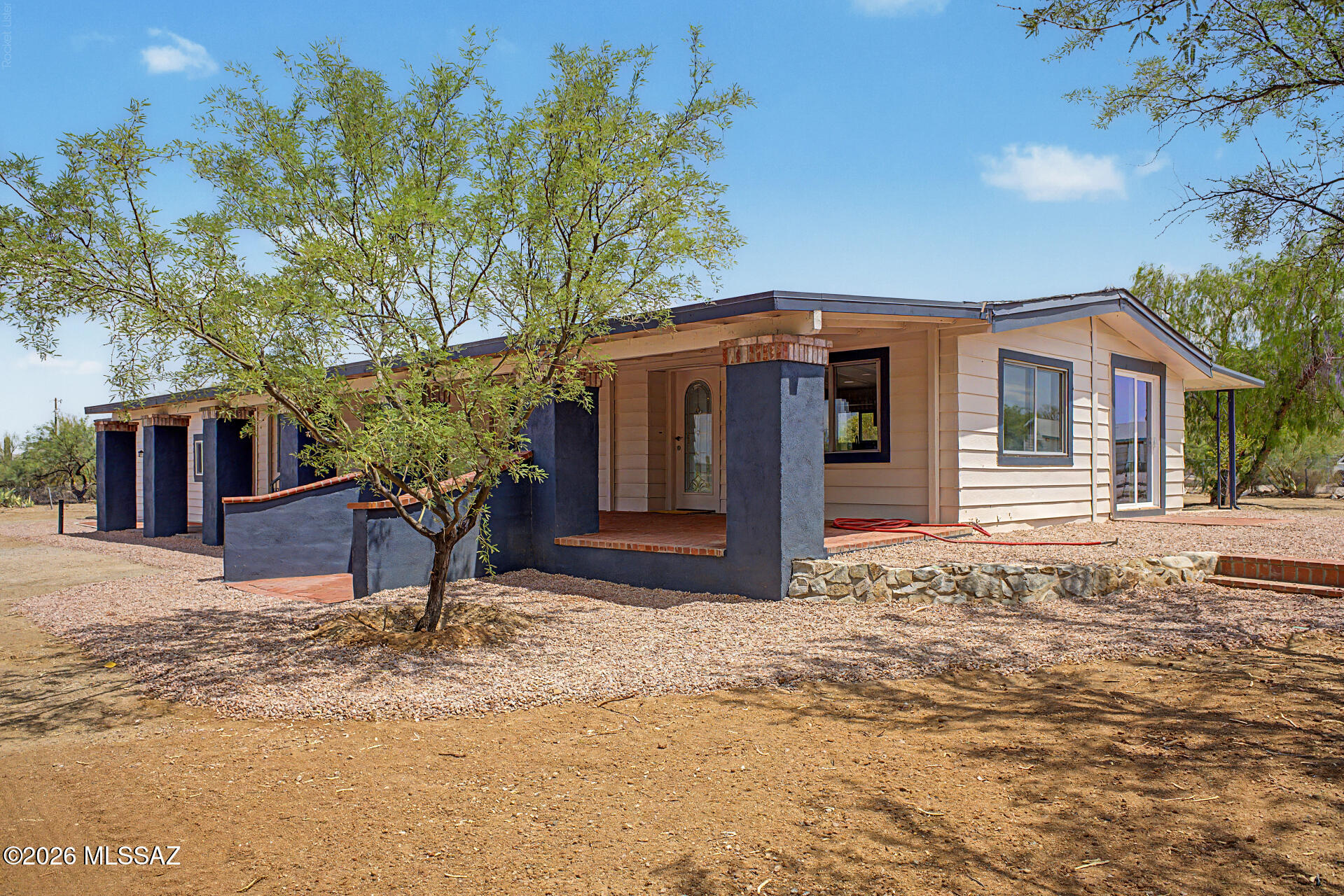 Fantastic opportunity to own this 3-bedroom, 2-bath home on a sprawling  1-acre lot! You're greeted by a spacious covered patio that sets an inviting tone. Inside, you'll find a bright and open layout with a soothing palette, recessed lighting, and stylish wood-look flooring. The updated kitchen comes with crisp white shaker cabinets and sleek stainless steel appliances for a delightful culinary experience. The primary bedroom includes a private bathroom for added comfort.t You'll be delighted by the attached casita, boasting sizeable living areas, a well-equipped kitchen, additional bedrooms, a bathroom, and a laundry room. Venture out onto the backyard, offering abundant space for crafting your dream outdoor oasis. Don't miss out on this fantastic opportunity. Owner financing available!