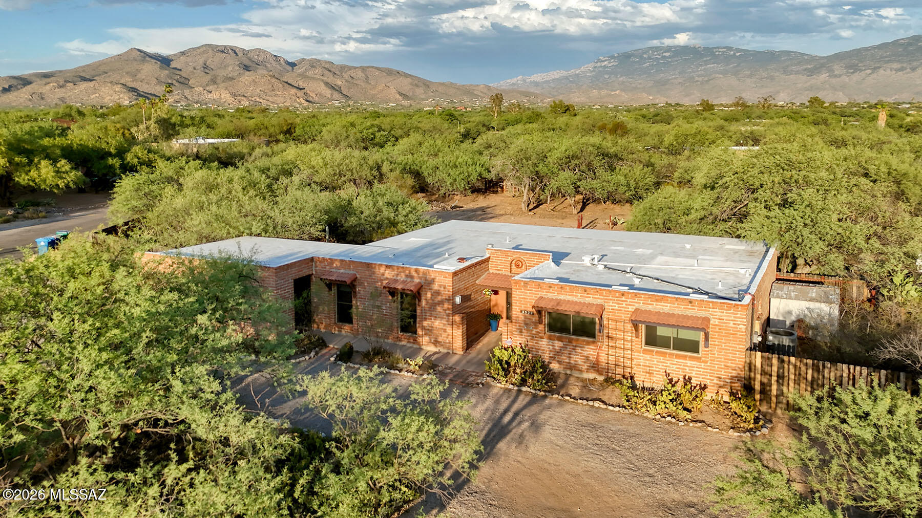 Charming home in the Tanque Verde Valley, offering timeless appeal and plenty of space to enjoy. The home features both a welcoming living room and a comfortable family room, providing flexible spaces for relaxing and entertaining. The kitchen includes a breakfast bar, breakfast nook, and doors leading to the back porch making it perfect for gatherings with family and friends. New carpet and paint add a fresh touch, while the pride of ownership is evident throughout the home. Situated on horse-zoned property, this home is perfect for equestrian enthusiasts or those seeking extra space and a rural lifestyle. The huge back of the property is fully enclosed, providing endless possibilities.  Don't miss this opportunity to own a well-loved home with the charm of southwest living. Same owner since the 1970s and the following improvements have been made in the 10 years:
New water line from meter to house, double pane windows on west side of house, new leach field, replaced HVAC system, new carpet June 2026, recoated roof, shower plumbing with access in both bathrooms and house rekeyed. 

There is a voluntary community association, Bel Air Estates Community Association (BARECA) more information can be found at bareca.org