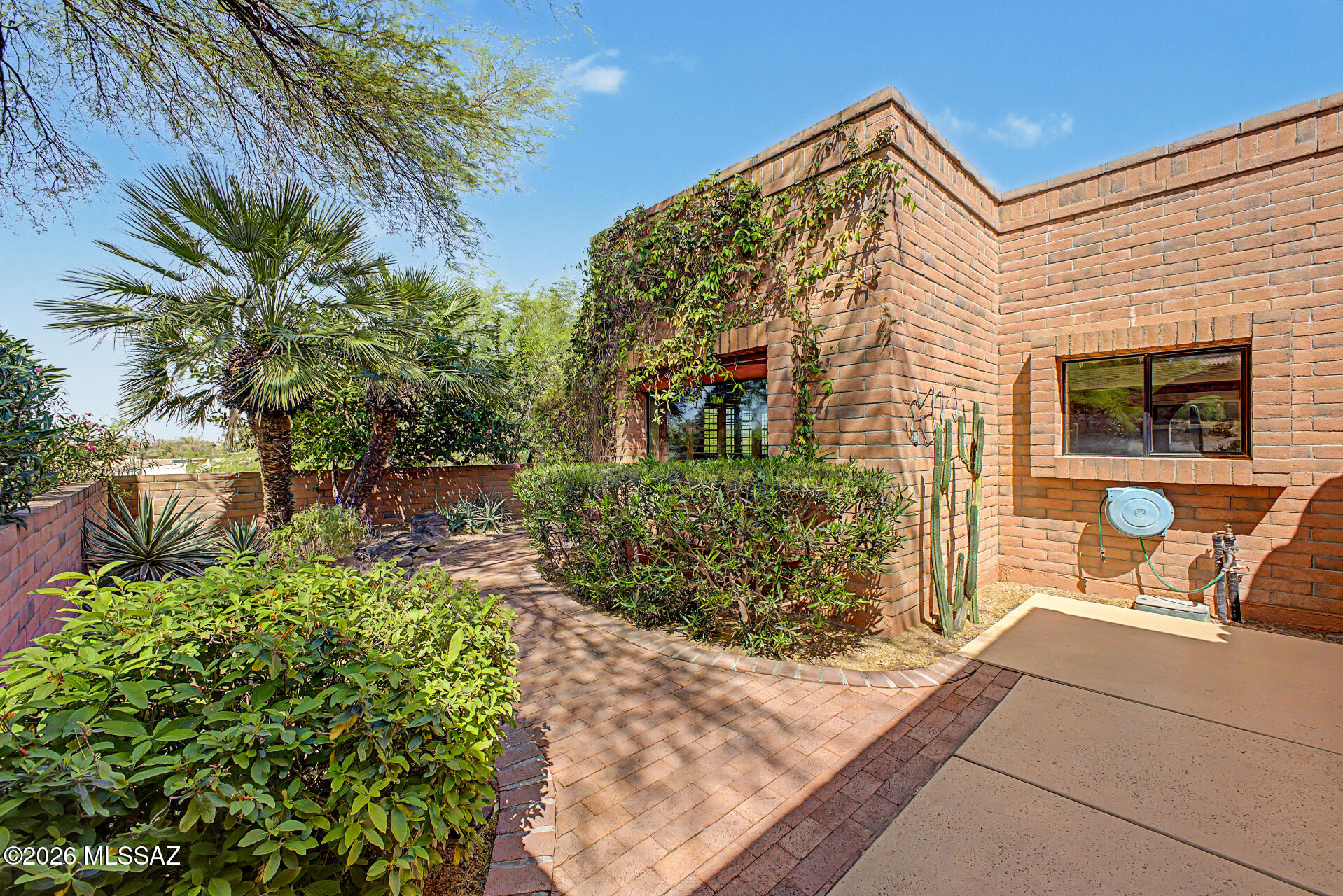 Located in a 55+ community, this home features a 2-car garage, professional landscaping, and a private courtyard. The interior includes a kiva fireplace, plantation shutters, and a neutral palette. The kitchen is updated with quartz countertops, oak cabinetry, and stainless steel appliances. 

The primary suite offers double sinks, a walk-in closet, and direct access to a wraparound patio overlooking mountain views. Recent maintenance includes tinted windows and an A/C and water heater all replaced within the last 10 years. Residents enjoy access to a community clubhouse, pool, shuffleboard, and tennis courts. This home provides a well-maintained living space in a quiet setting.