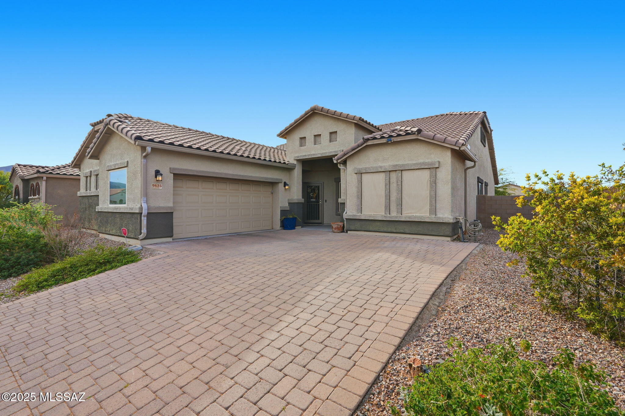 Discover this semi-custom home in the sought-after Saguaro Bloom community, offering comfort, privacy, and true move-in readiness. Located on a corner lot with no neighbors directly behind and a neighborhood park just across the street, this home enjoys exceptional privacy and an open feel. The spacious layout features tile flooring throughout, 11-foot ceilings, and plantation shutters, creating a bright and welcoming atmosphere. The home features a reverse osmosis system, a tankless water heater, and a water softener. Step outside to a fully completed, professionally landscaped backyard with artificial turf, ready for immediate enjoyment. Priced very well and offering the opportunity for instant equity, this home is an excellent value in a desirable location.