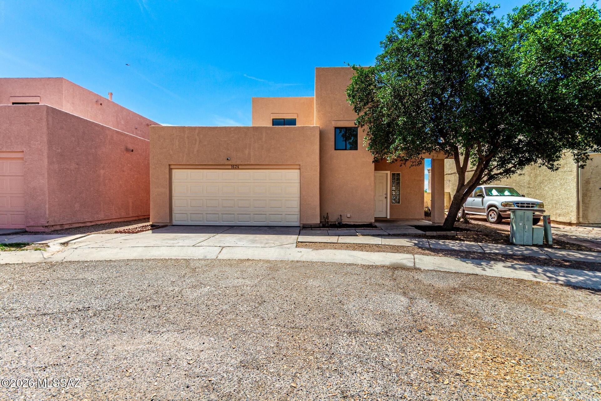 Beautifully updated 4 bedroom, 2 bath home with a VA assumable loan. An incredible opportunity for qualified buyers! Ideally located near Raytheon, Tucson International Airport, and quick access to I-10 for an easy commute. This move-in ready home features stainless steel appliances (2023), a new kitchen sink and bathroom toilets (2023), new washer and dryer (2025), and all new carpet including the downstairs primary bedroom (2026). The entire interior and exterior were freshly repainted (2026), along with new bathroom shower and tub inserts (2026). A fantastic combination of location, upgrades, and financing opportunity! Take a look at your new home today!