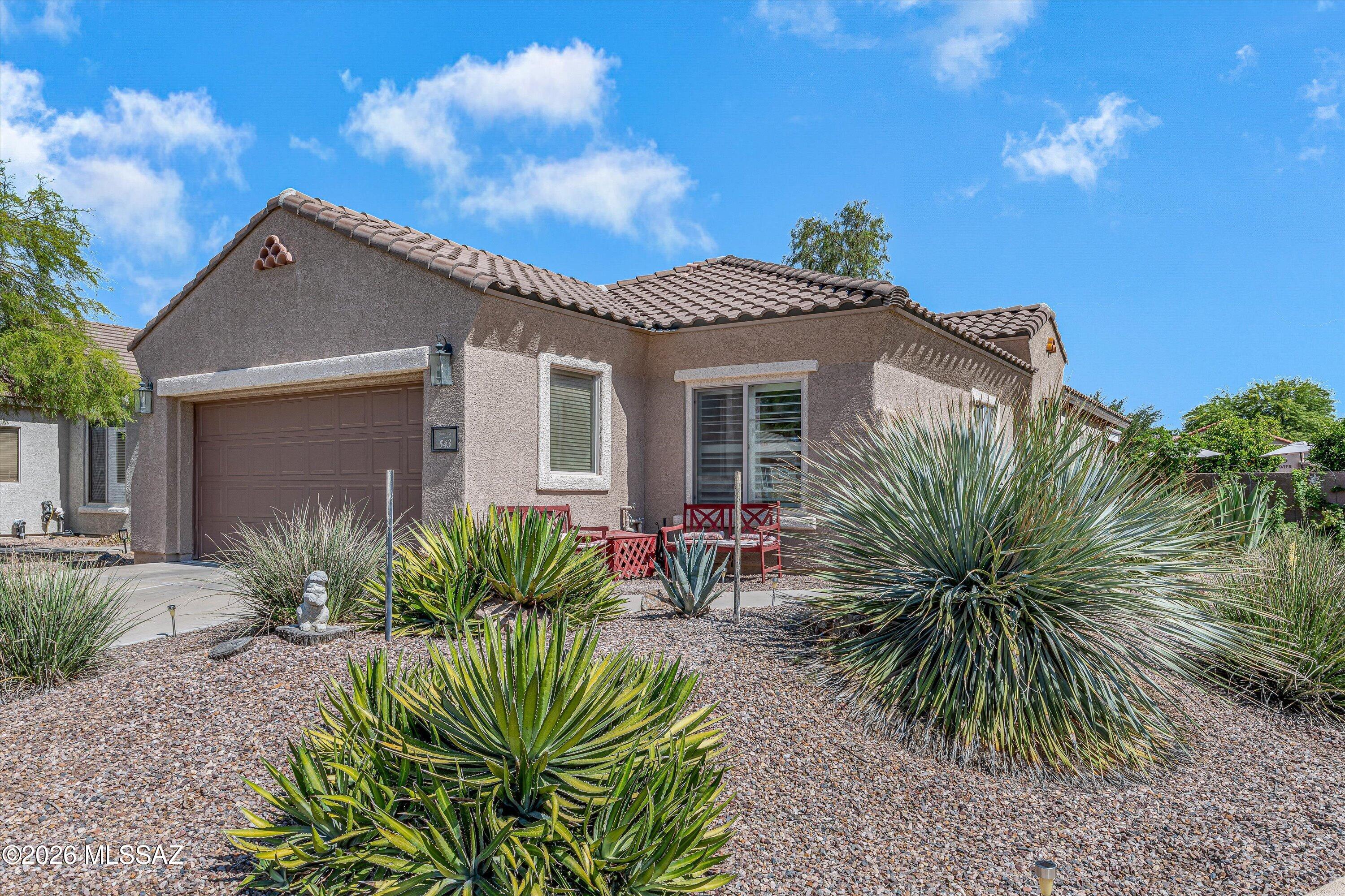 Enjoy all that 55+ living has to offer in this charming turn-key property located in Sonora by Del Webb in Rancho Sahuarita. The home sits on a large corner lot with no neighbors behind and just steps away from the exclusive 55+ Sonora Clubhouse. Enjoy the backyard oasis, perfect for entertaining with the built-in barbecue and/or lounging in the shade of the fruit trees. The home features a newer HVAC (5 years old, serviced every 6 months), upgraded bathrooms with new bidet toilets, kitchen with island and stainless steel appliances, and more. With a home in excellent condition like this one, you will have more time to enjoy the exclusive Sonora Clubhouse--meeting neighbors, making friends, playing pickleball, swimming in the heated pool, and so much more.