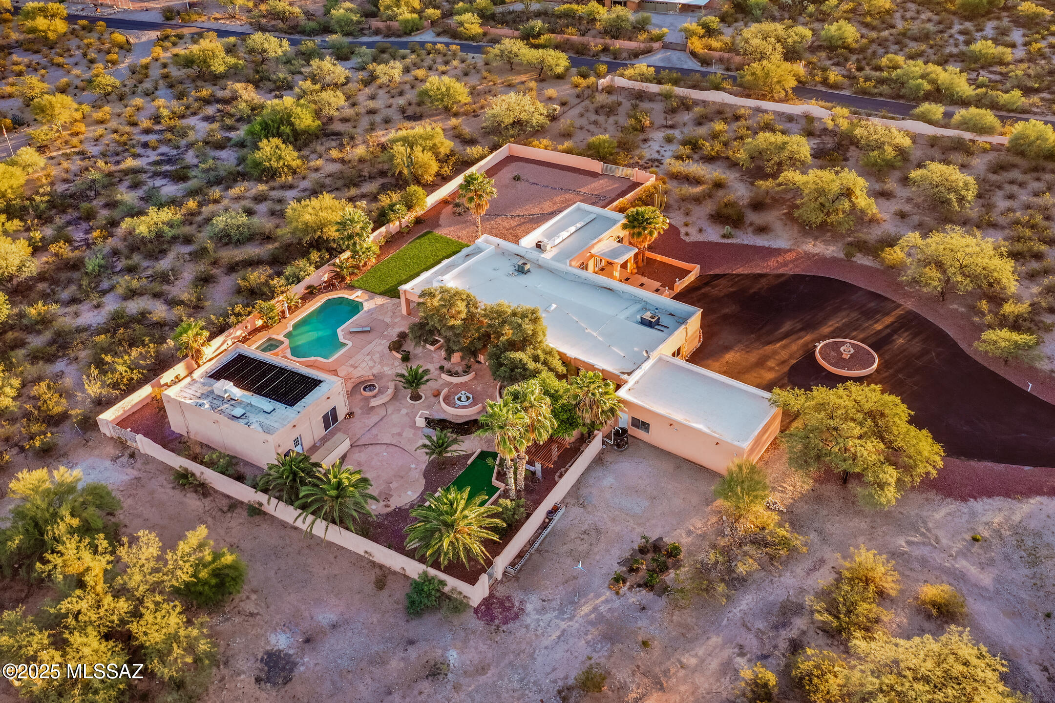 Your Private Desert Resort Awaits 🌵✨

Tucked behind secure gates on 3.4 acres of desert beauty, this extraordinary Tucson retreat blends luxury living with pure adventure. Panoramic mountain views stretch endlessly, sunsets paint the sky in gold, and every inch of the property whispers relaxation, privacy, and play.

Inside the 3,360+ sq ft main home, two full primary suites offer ultimate comfort and flexibility. The open-concept layout flows seamlessly into a chef's kitchen built for entertaining and a cozy movie-night living room with a drop-down screen and projector — perfect after an evening swim under the stars. Step outside to your own resort oasis: a sparkling pool and spa, tranquil koi pond with cascading waterfalls that hide secret grotto, and multiple gathering spaces designed for laughter, dining, and firelight.

Need room for guests, hobbies, or events? The 1,200 sq ft detached pool house with its own bathroom delivers endless options  guest quarters, studio, or weekend getaway space.

And for the thrill-seekers  yes, it gets even better. A private ATV/go-kart track and a dedicated motocross course turn every day into an adventure.

This one-of-a-kind estate offers a lifestyle most only dream about  luxury, leisure, and limitless fun all in one breathtaking setting. Why vacation anywhere else when your private resort is home? Your next chapter starts here!