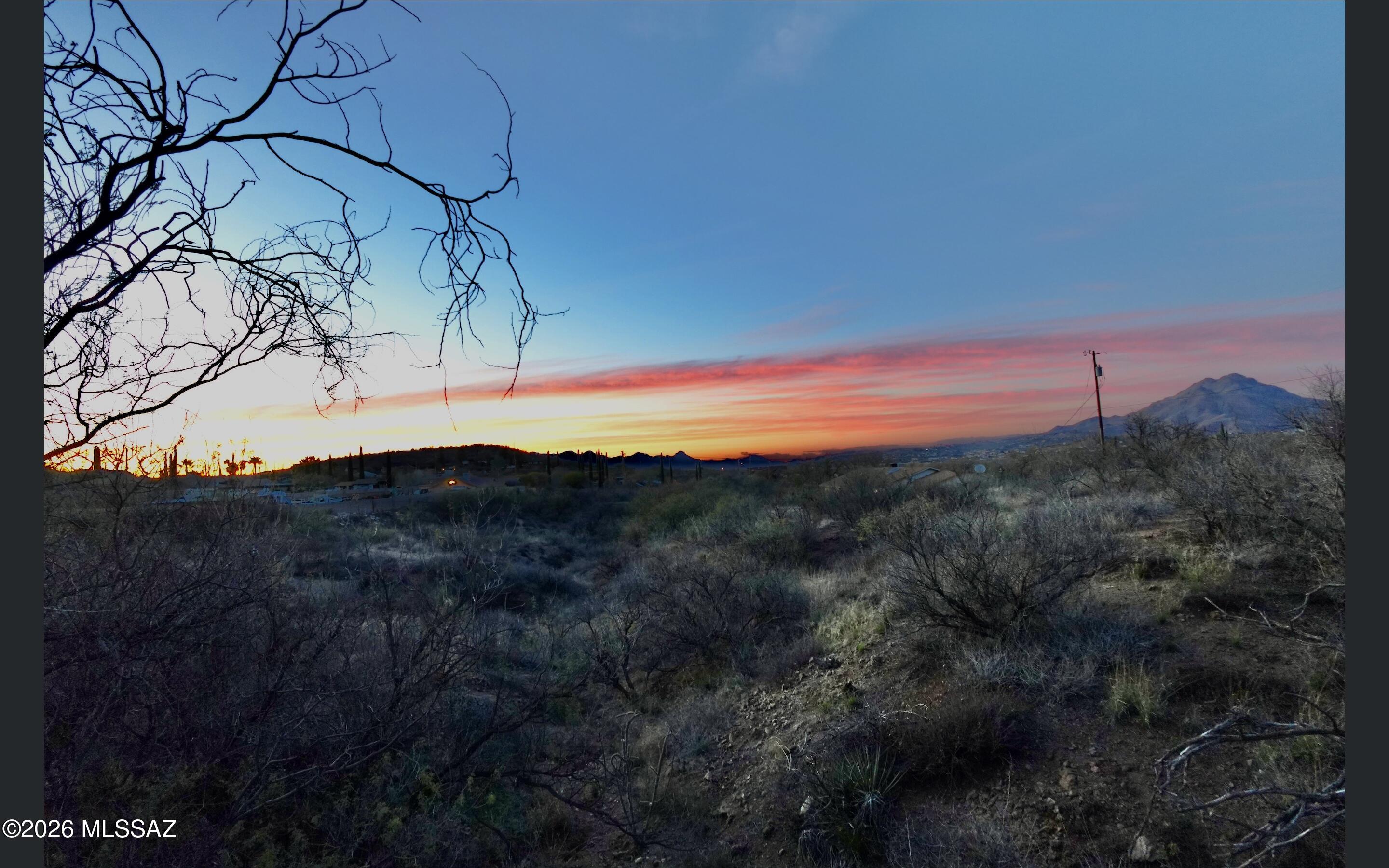 Welcome to 100 Calle Quintana, a rare opportunity to own raw land in the rolling hills of Rio Rico, where wide-open skies, mountain silhouettes, and quiet surroundings set the stage for something truly special.
This parcel offers the freedom that existing homes simply can't: the ability to design a custom residence tailored to your lifestyle, whether that's a modern desert retreat, a sprawling single-story ranch, or a private escape with room to breathe. With natural terrain and open space as your canvas, the possibilities here are limited only by your vision.
Located in a peaceful area yet still within convenient reach of town amenities, this property strikes the ideal balance between privacy and accessibility. Enjoy sunsets that stop you in your tracks, star-filled nights, .. and the sense of space that reminds you why you chose Southern Arizona in the first place.
Raw land means no outdated floor plans, no renovation headaches, and no settling--just opportunity. Bring your builder, your architect, and your imagination, and create something lasting in a community where space, views, and potential still exist.
If you've been waiting for the right piece of land to build your future, this is it.