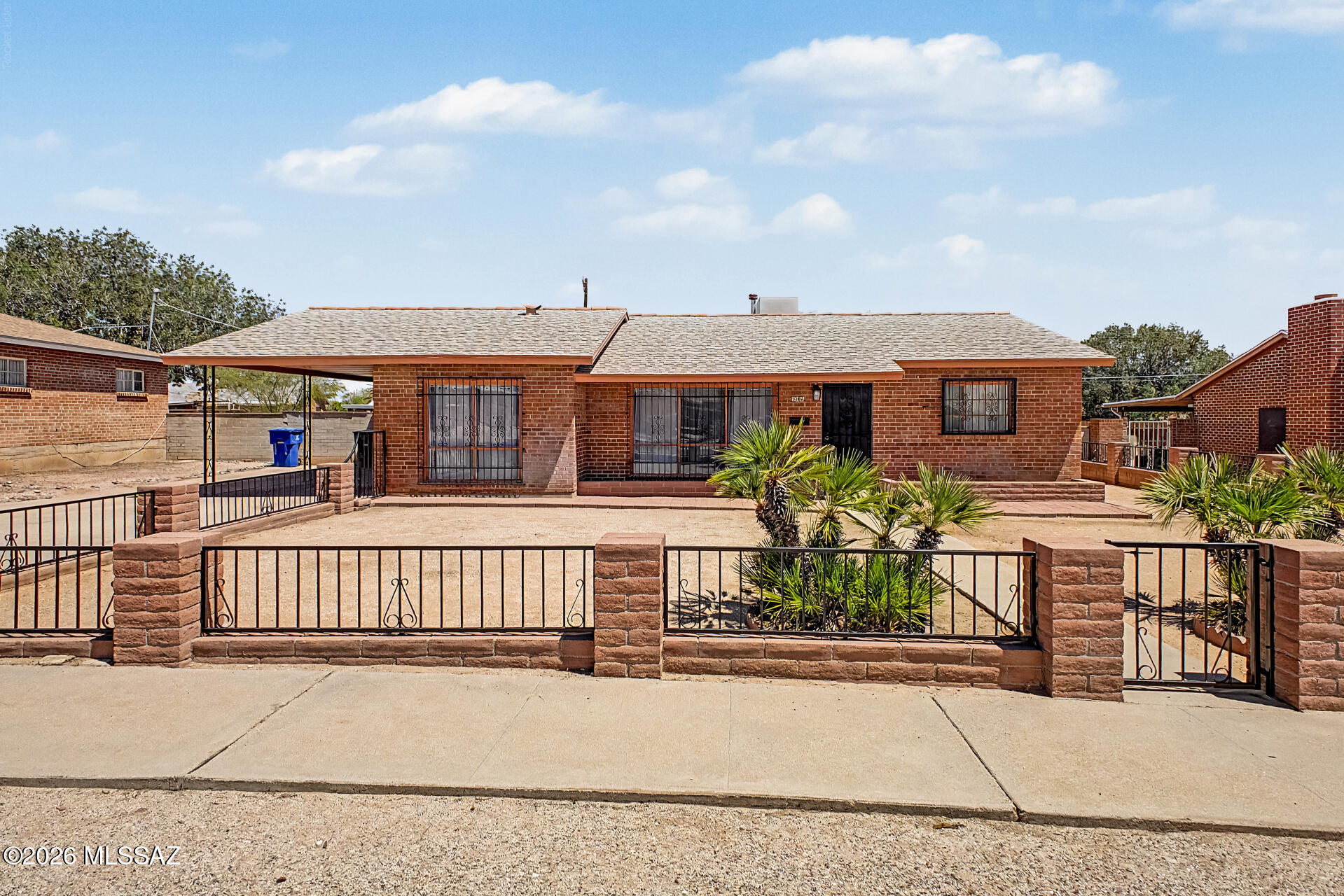 Welcome home to this charming 3-bedroom, 2-bath brick home in one of Tucson's most desirable East Side neighborhoods. From the moment you step inside, you'll picture cozy Christmas mornings with the tree glowing in the spacious bonus room, where family and friends gather to celebrate, watch holiday movies, and create lasting memories. The beautifully remodeled kitchen and updated bathroom complement the home's timeless character, while the expansive bonus room is perfect for entertaining year-round. Enjoy peace of mind with a brand-new roof, all-new whole-house plumbing featuring durable PEX, and valuable warranties including 10 years on roof shingles, 3 years on the flat roof, a 10-year parts and labor warranty on exterior plumbing, and a 25-year PEX warranty. Wrought-iron window bars and security screens add an extra layer of security. Conveniently located near shopping, dining, parks, and schools, this move-in-ready home offers comfort, quality, and lasting value.